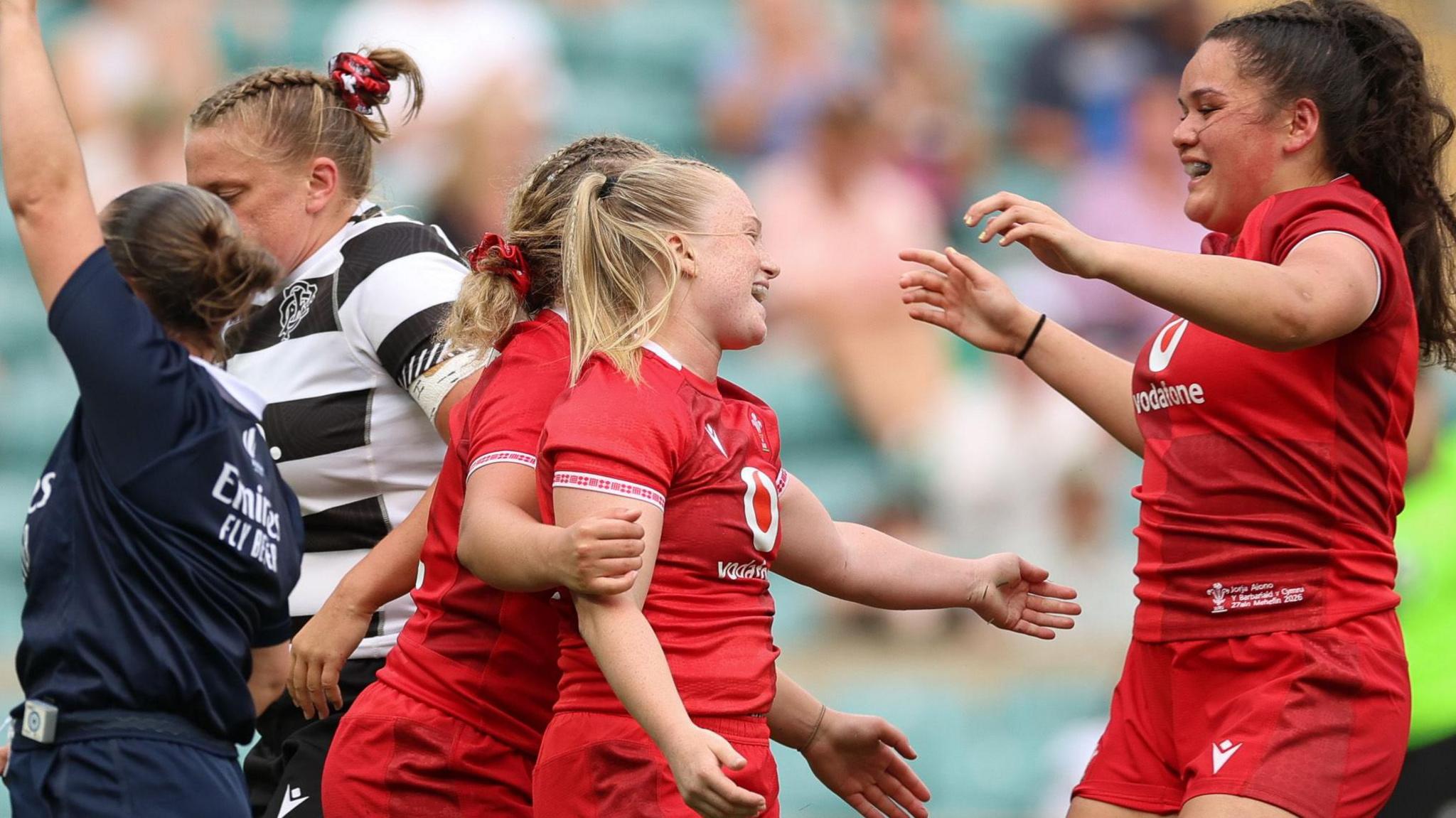 Seren Lockwood celebrates with her team-mates after scoring for Wales against Barbarians at Twickenham
