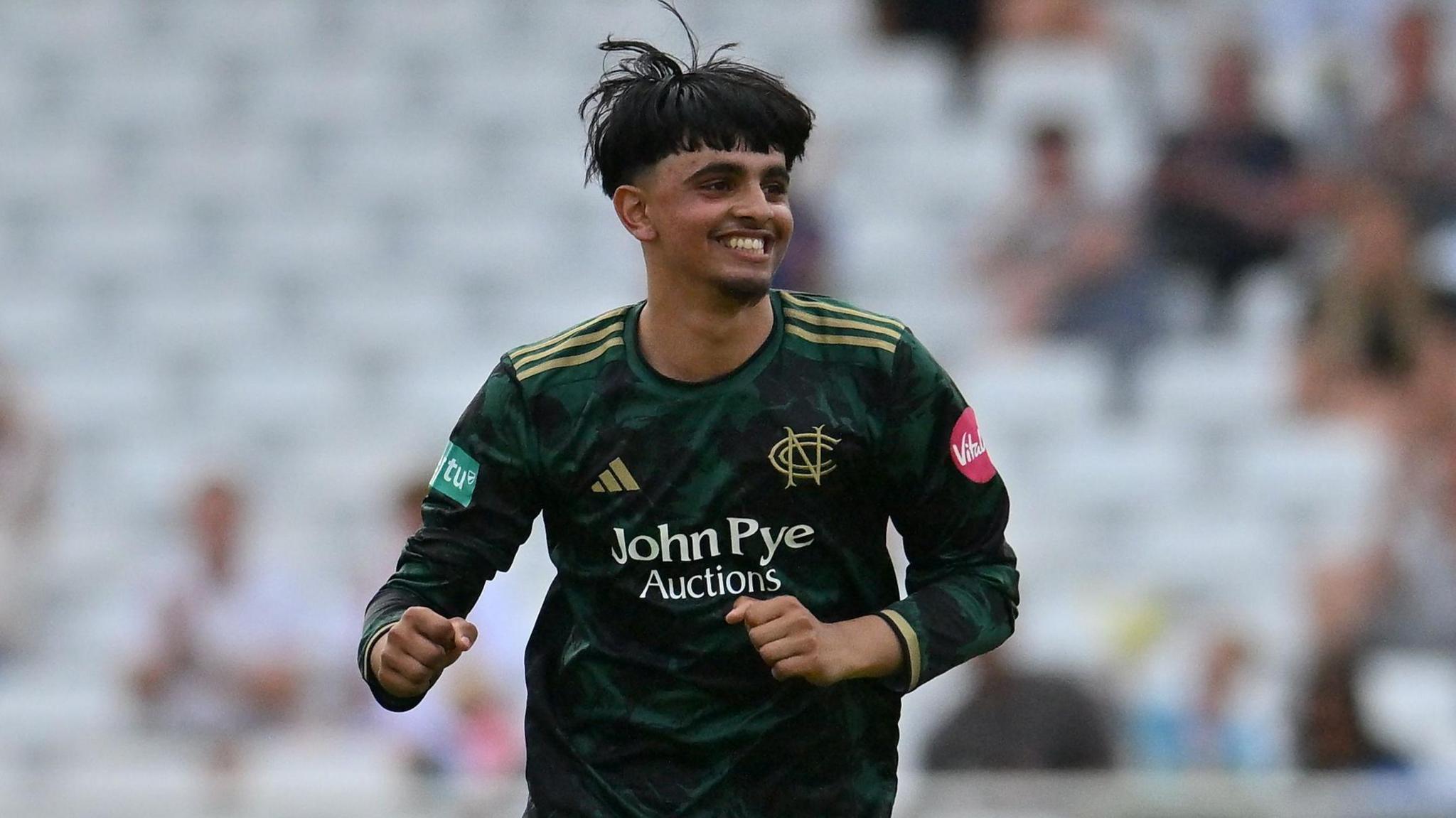 Nottinghamshire's Farhan Ahmed celebrating taking a wicket