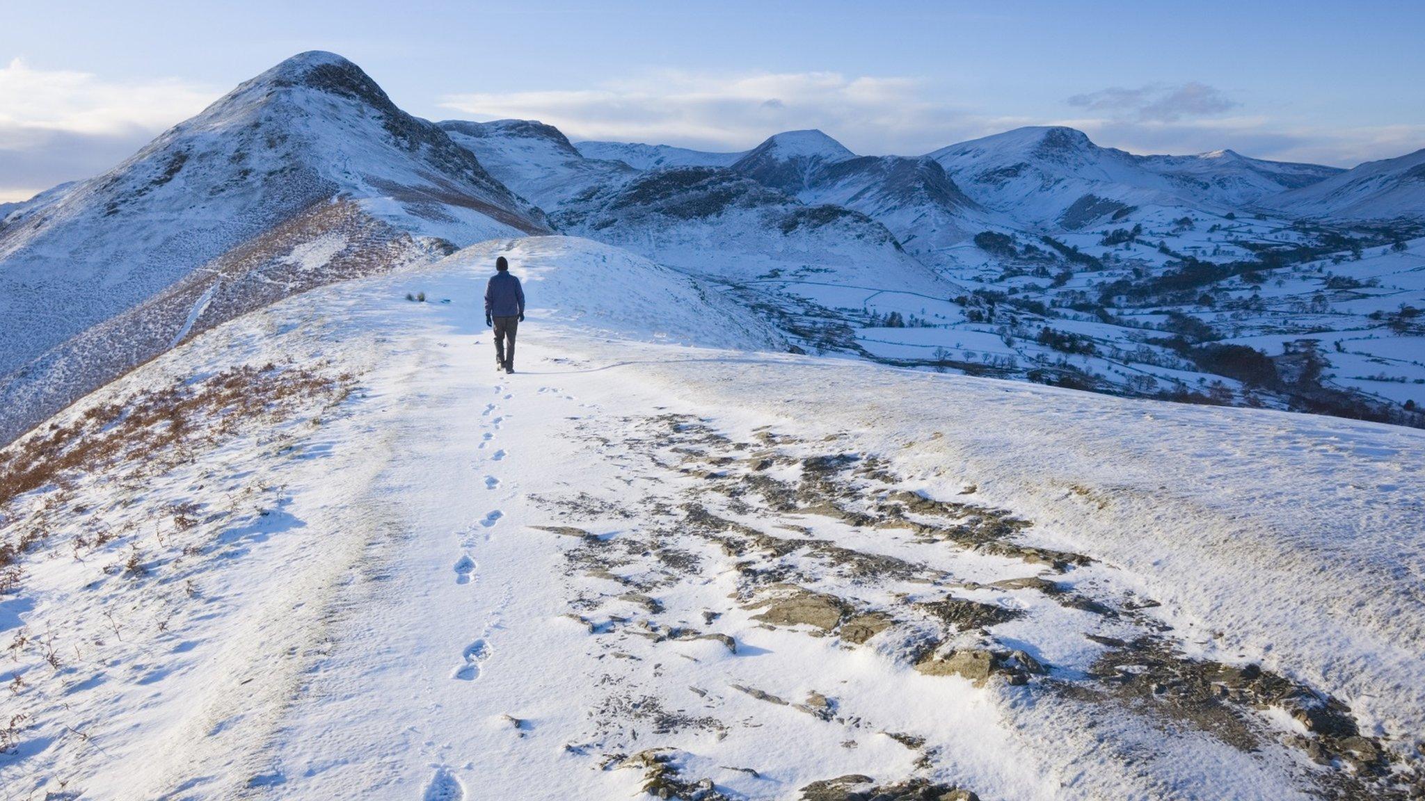 A walker on a Lake District hillside