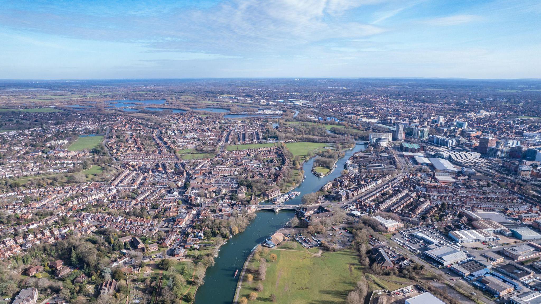 A bird's eye picture of Reading, with the River Thames running through the middle of the town and picture. 