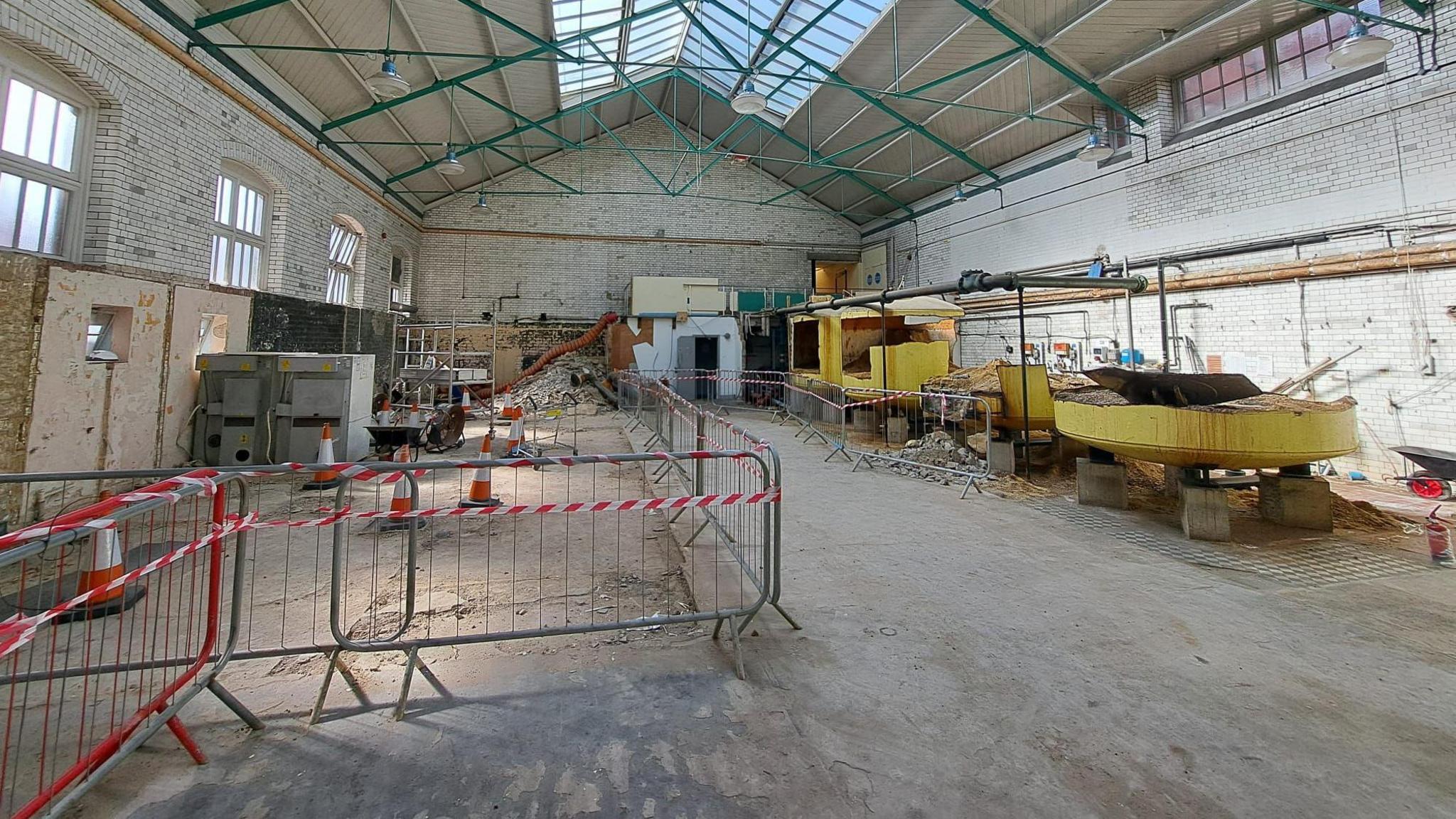 Rubble on the floor and metal barriers inside the Health Hydro