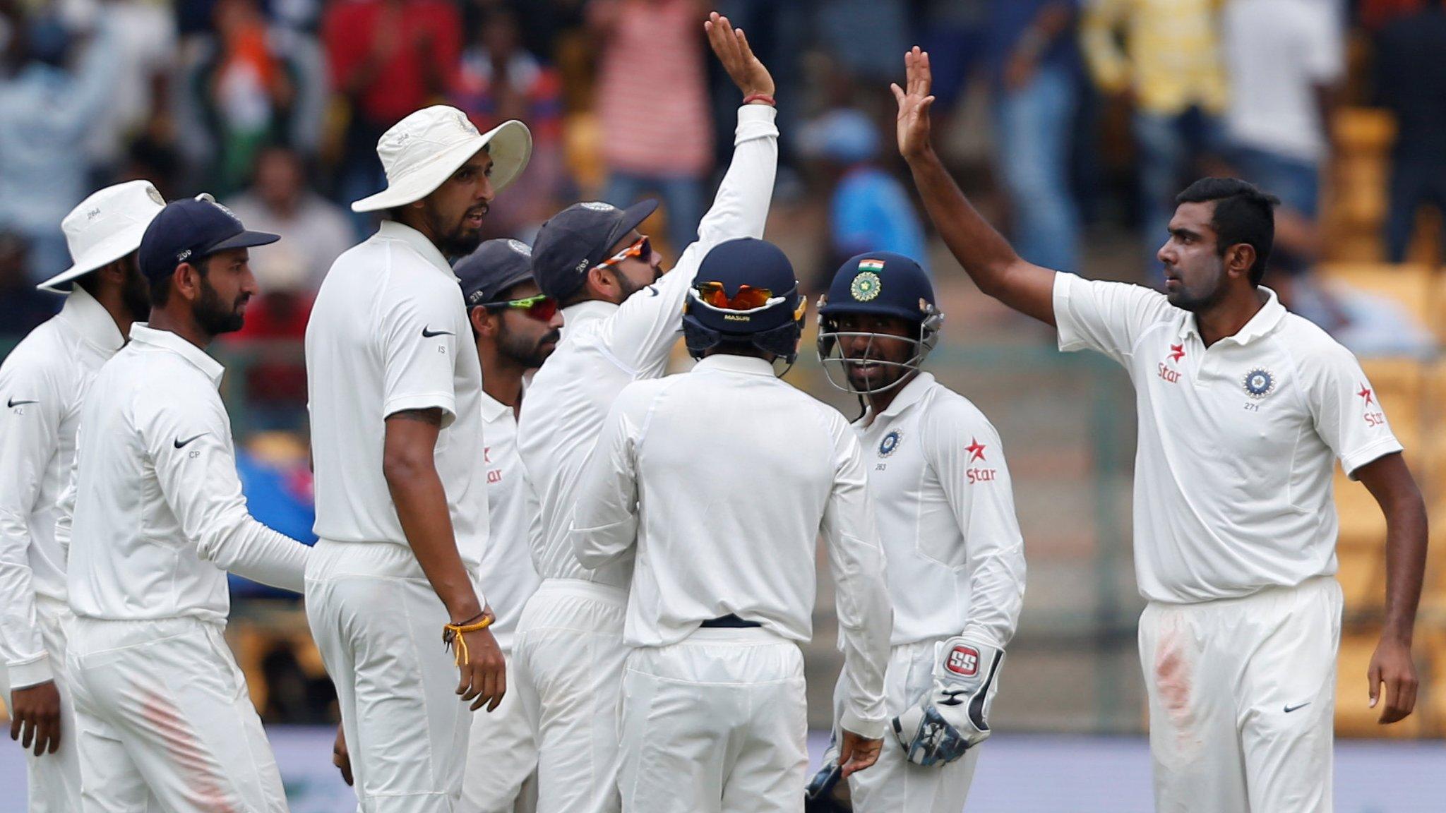 India celebrate a wicket for Ravichandran Ashwin