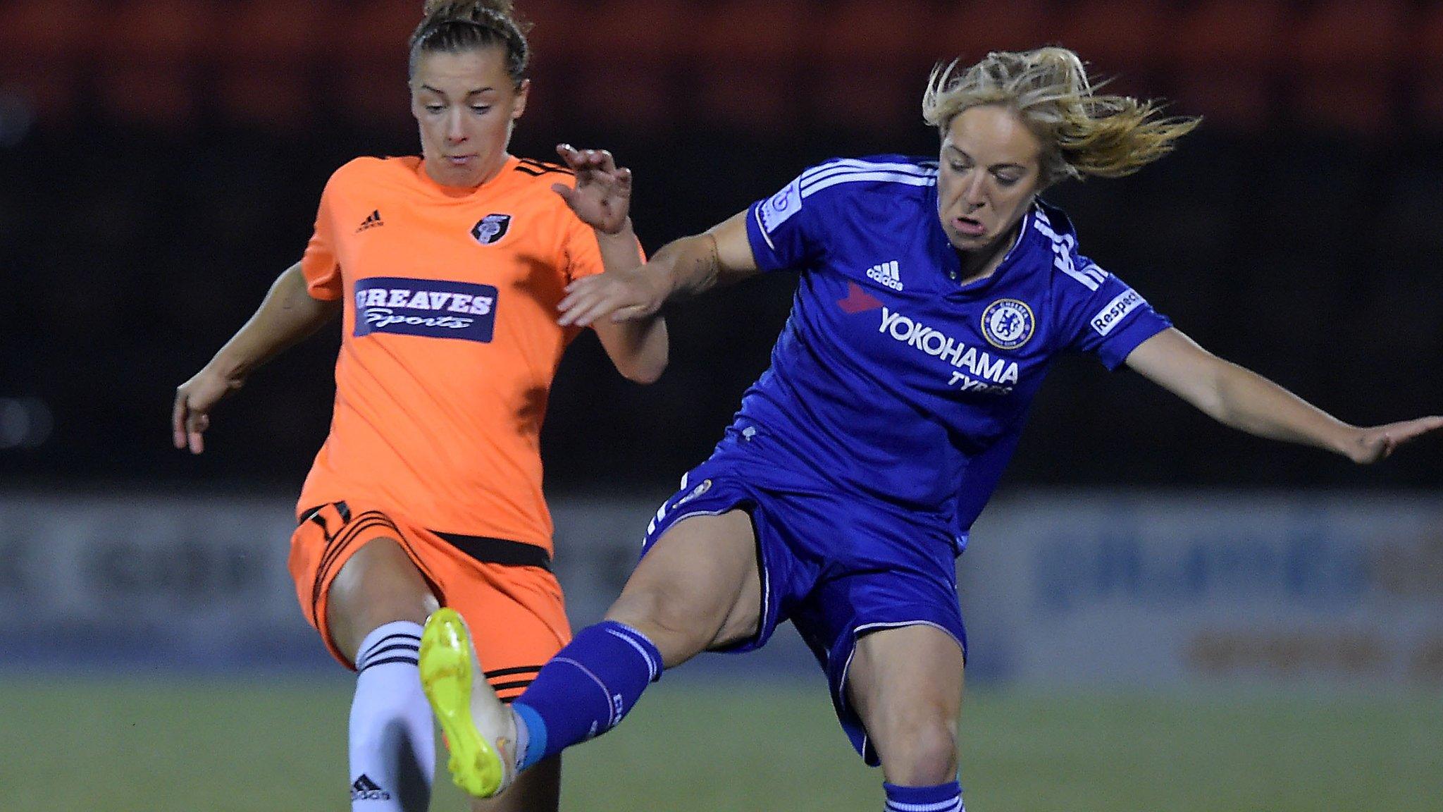 Nicola Docherty (left) and Claire Rafferty challenge for the ball