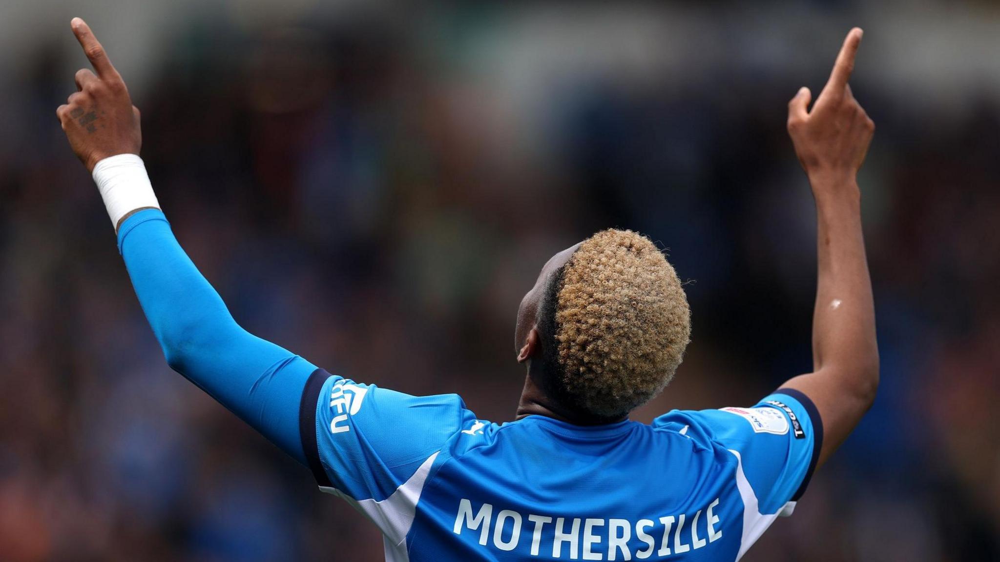 Malik Mothersille celebrates his first goal for Stockport County