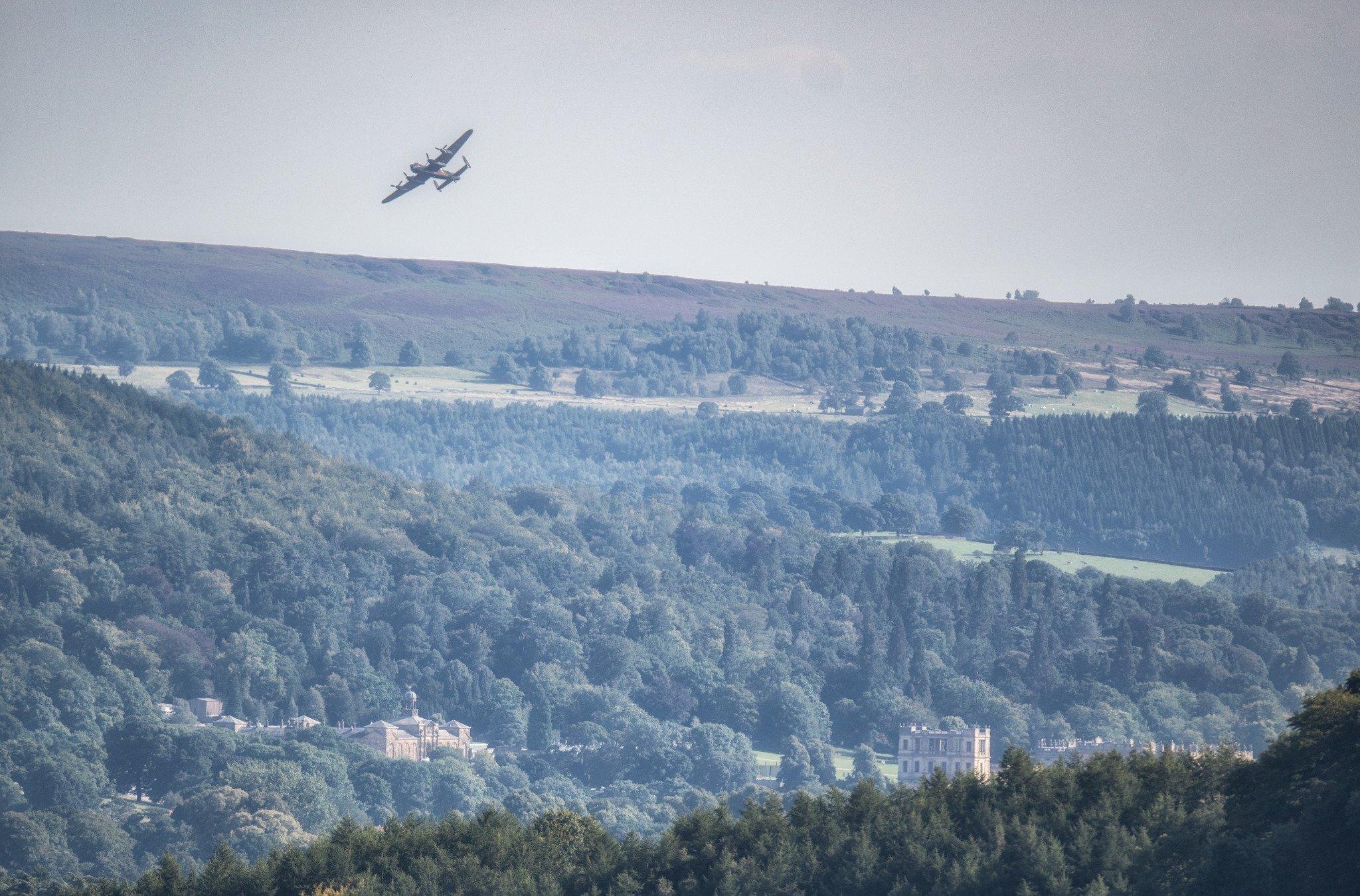 Lancaster Bomber flying over Chatsworth House, in Derbyshire