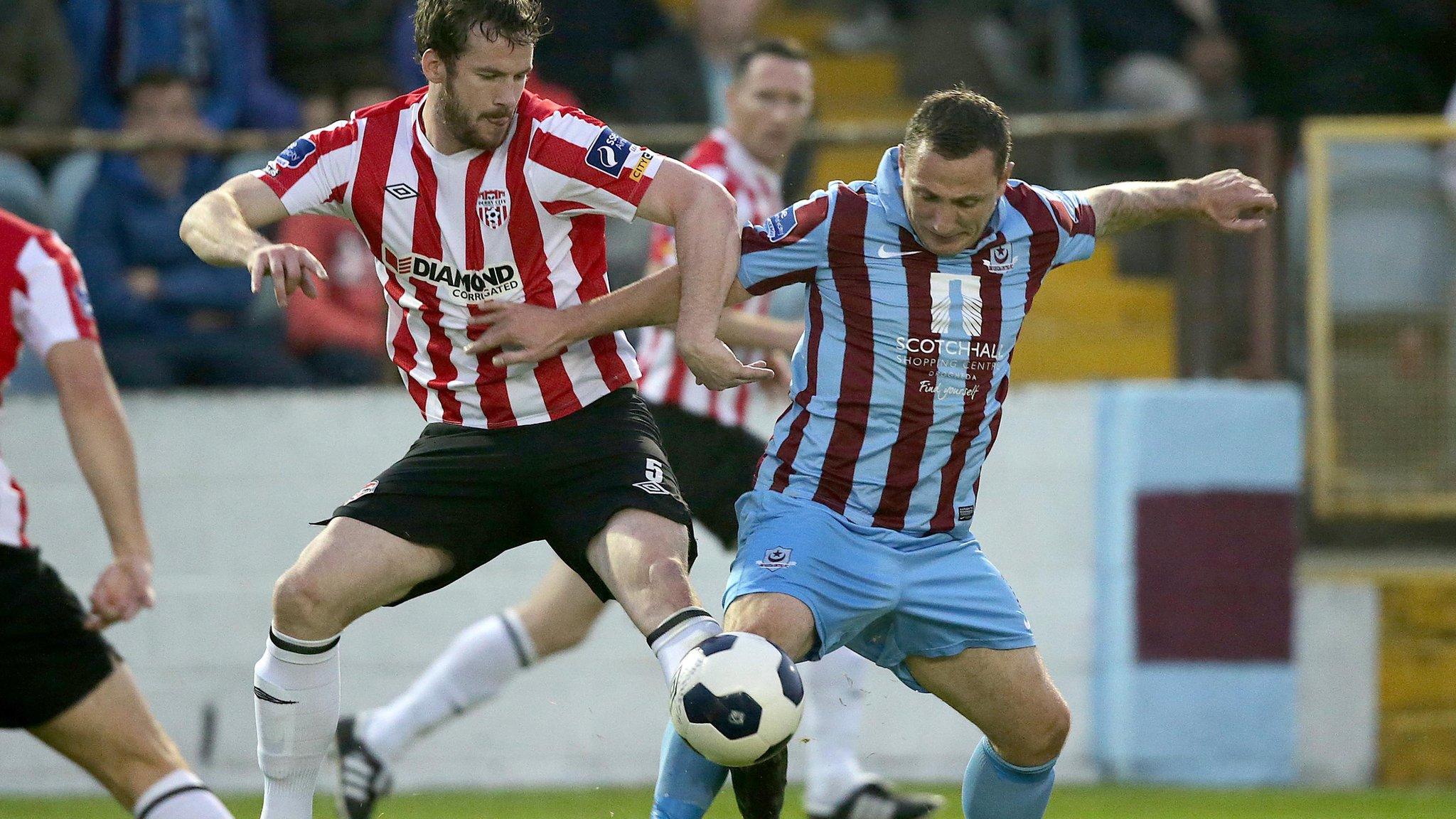 Derry defender Ryan McBride tussles with Drogheda's Gary O'Neill