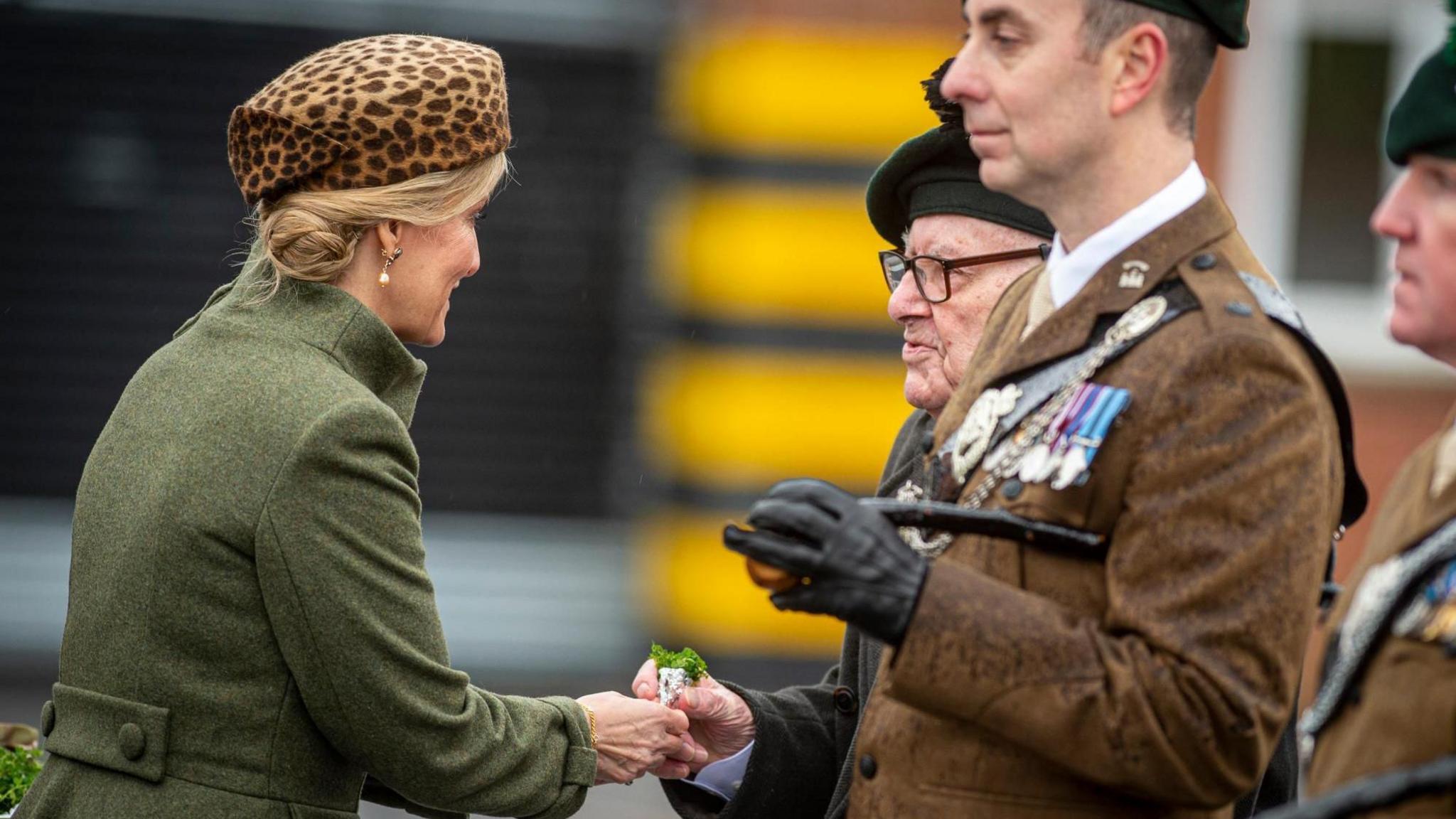 George Horner recieving a sprig of Shamrock from the Duchess of Edinburgh