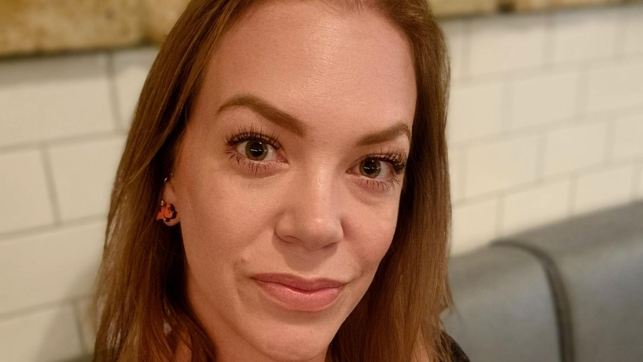 A selfie of Rhiannon Lawson, who has brown hair and brown eyes