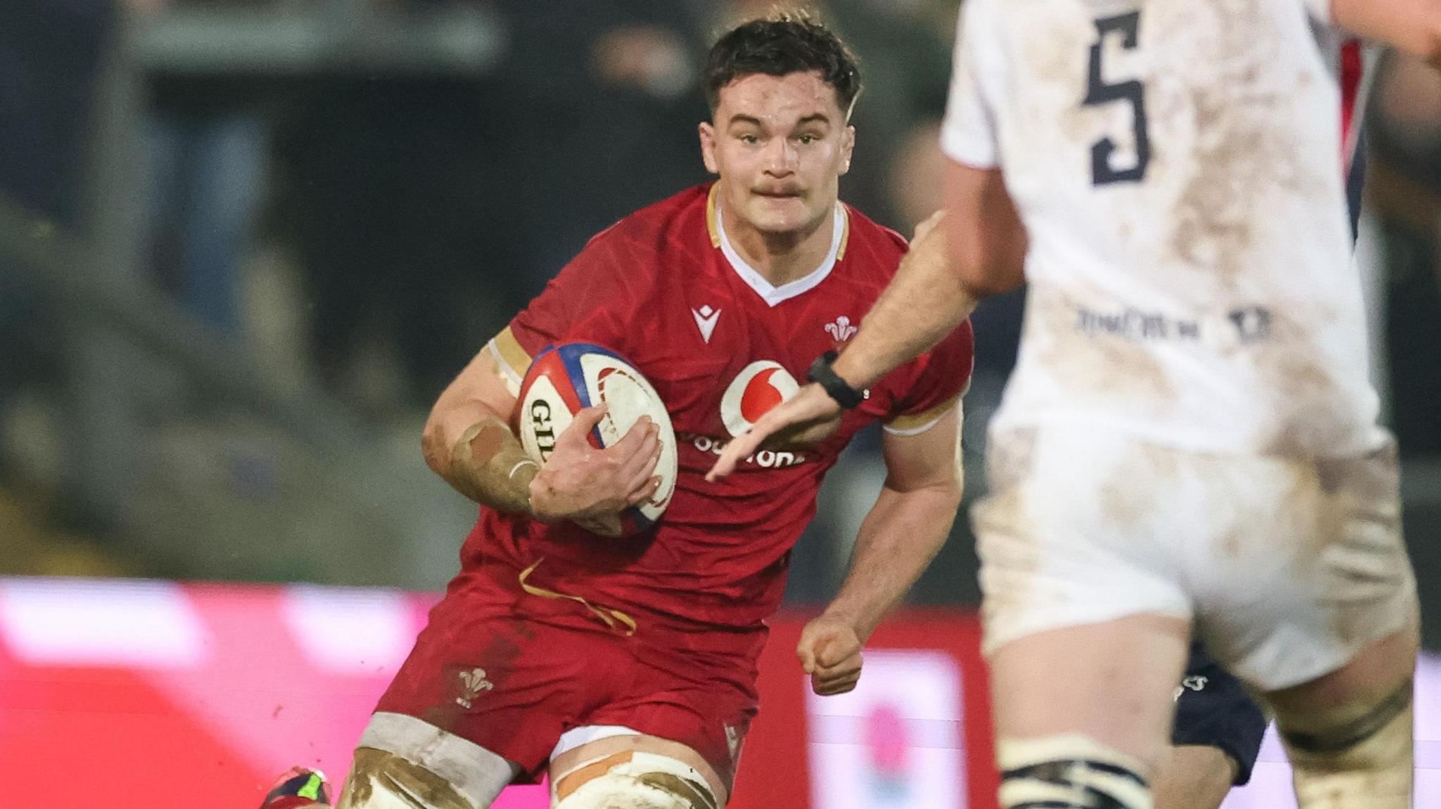 Deian Gwynne runs with the ball for Wales Under-20s against England