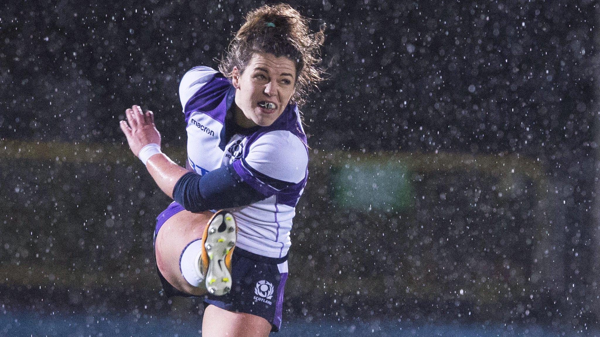 Lisa Martin kicks the ball for Scotland Women