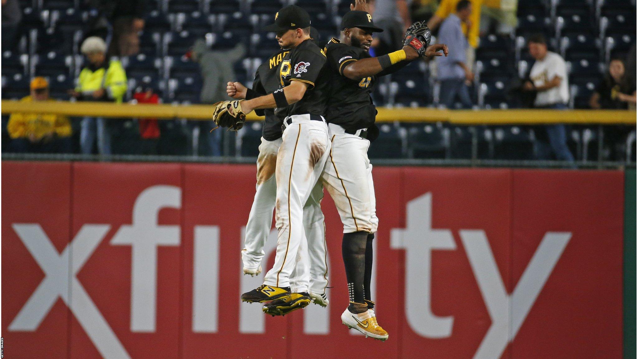 Pittsburgh, Pennsylvania, US, 5 June: Bryan Reynolds 10, Starling Marte #6 and Gregory Polanco 25 of the Pittsburgh Pirates celebrate after defeating the Atlanta Braves 7-4. (Photo by Justin K. Aller/Getty Images)