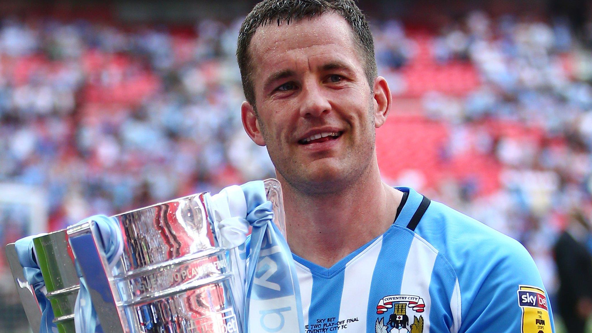 Michael Doyle celebrates Coventry's promotion to League One