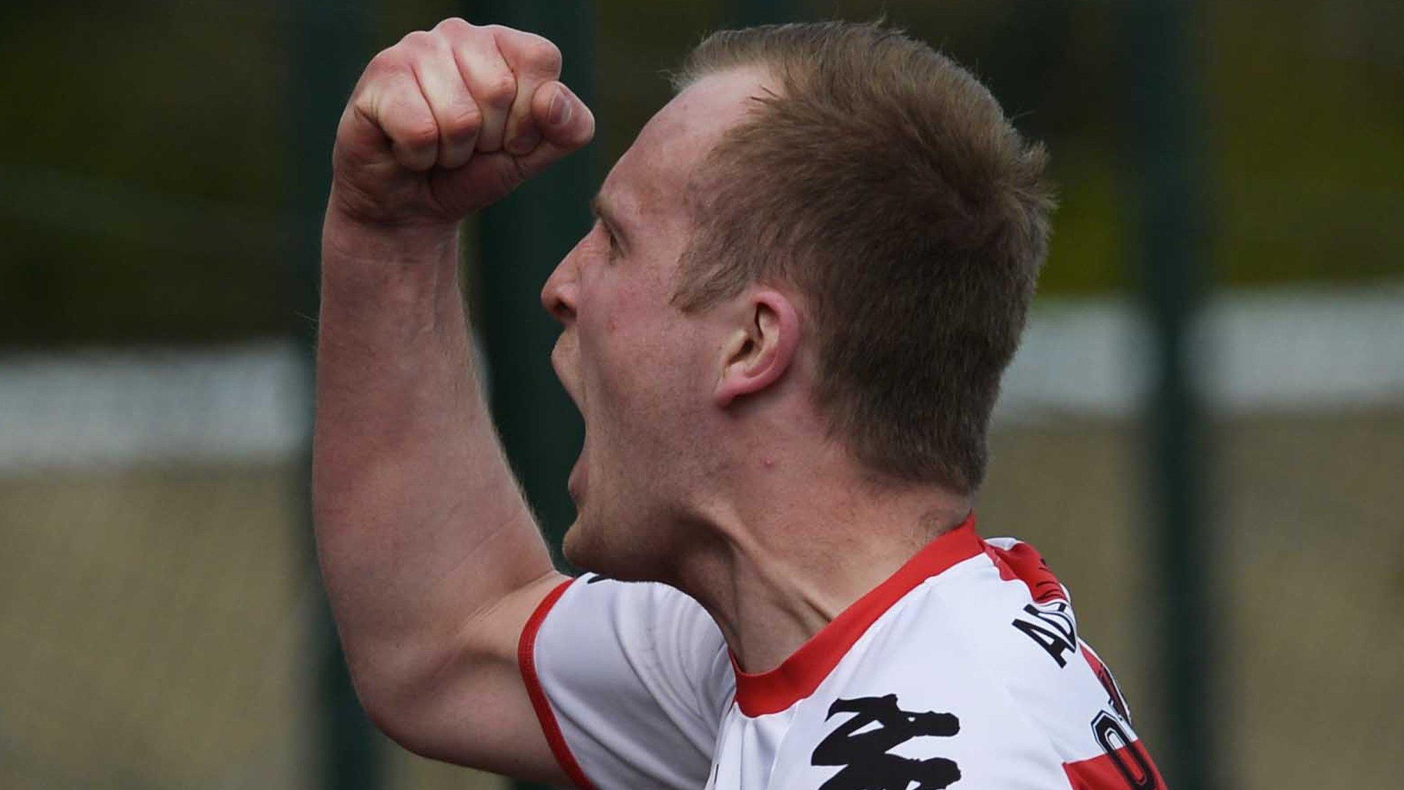 Crues striker Jordan Owens celebrates scoring the winner at Solitude