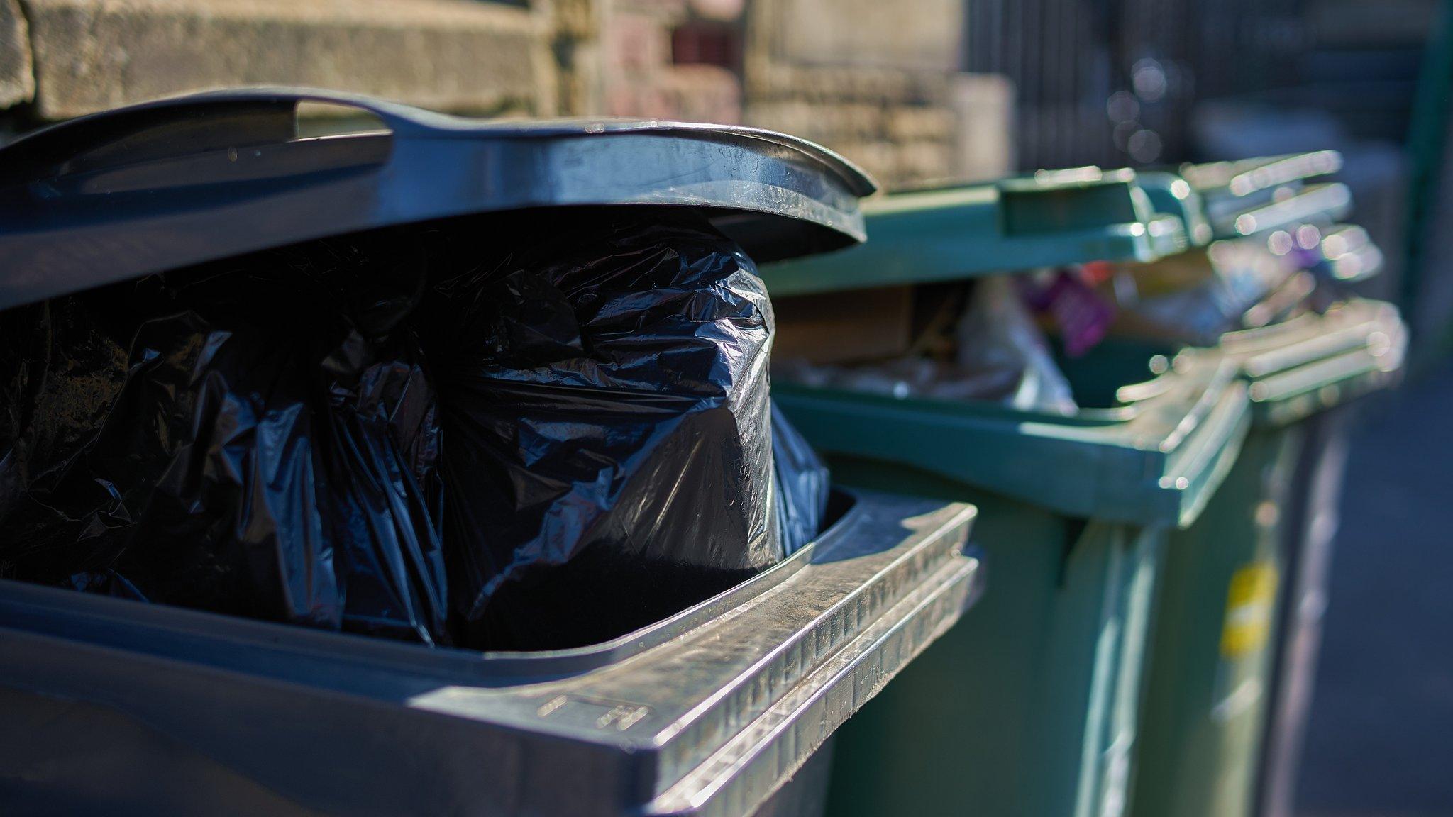 Overflowing wheelie bins