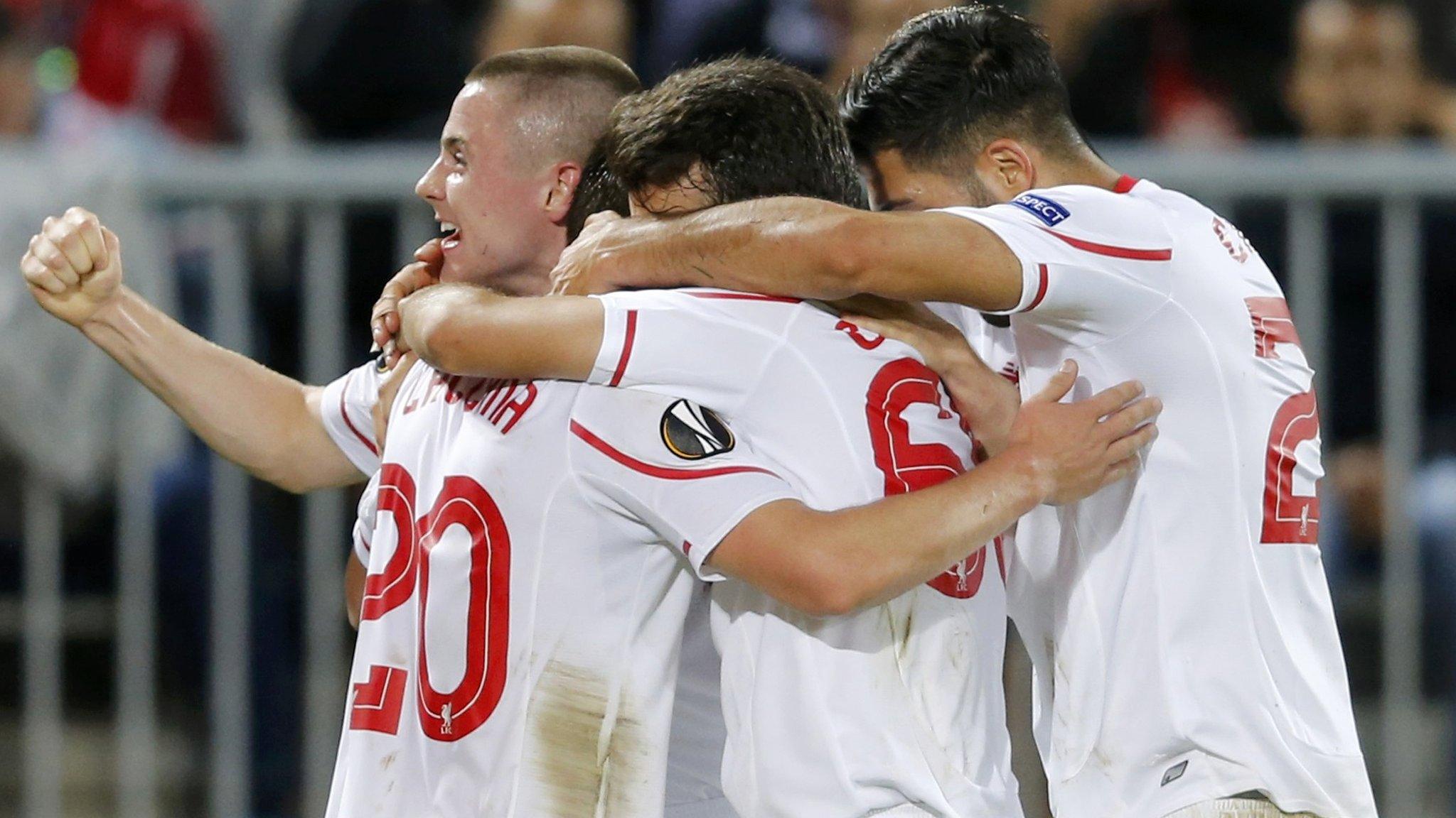 Adam Lallana celebrates with team-mates