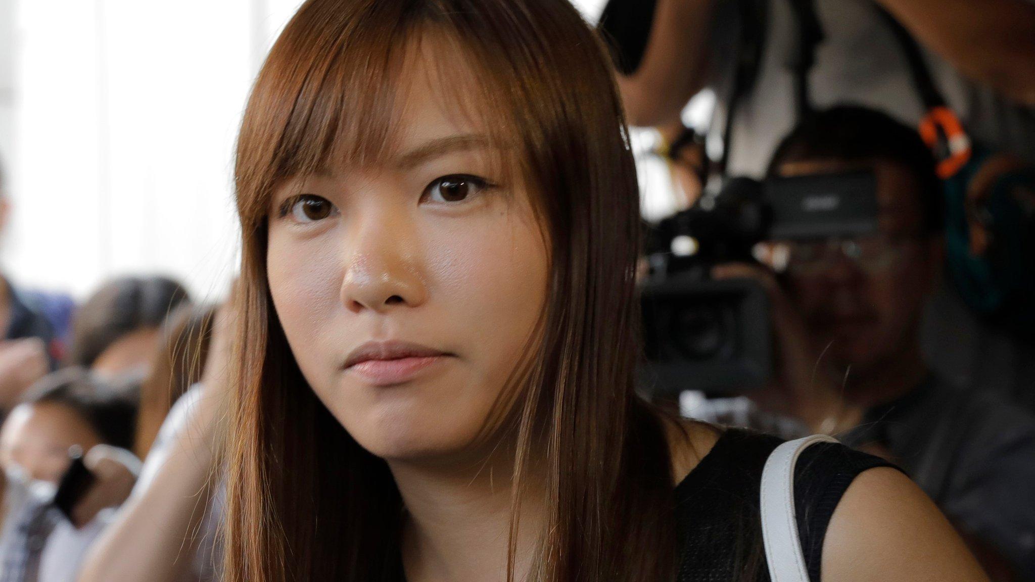 Newly elected Hong Kong lawmaker Yau Wai-ching listens to reporter"s questions outside the high court in Hong Kong Tuesday, Nov. 15, 2016