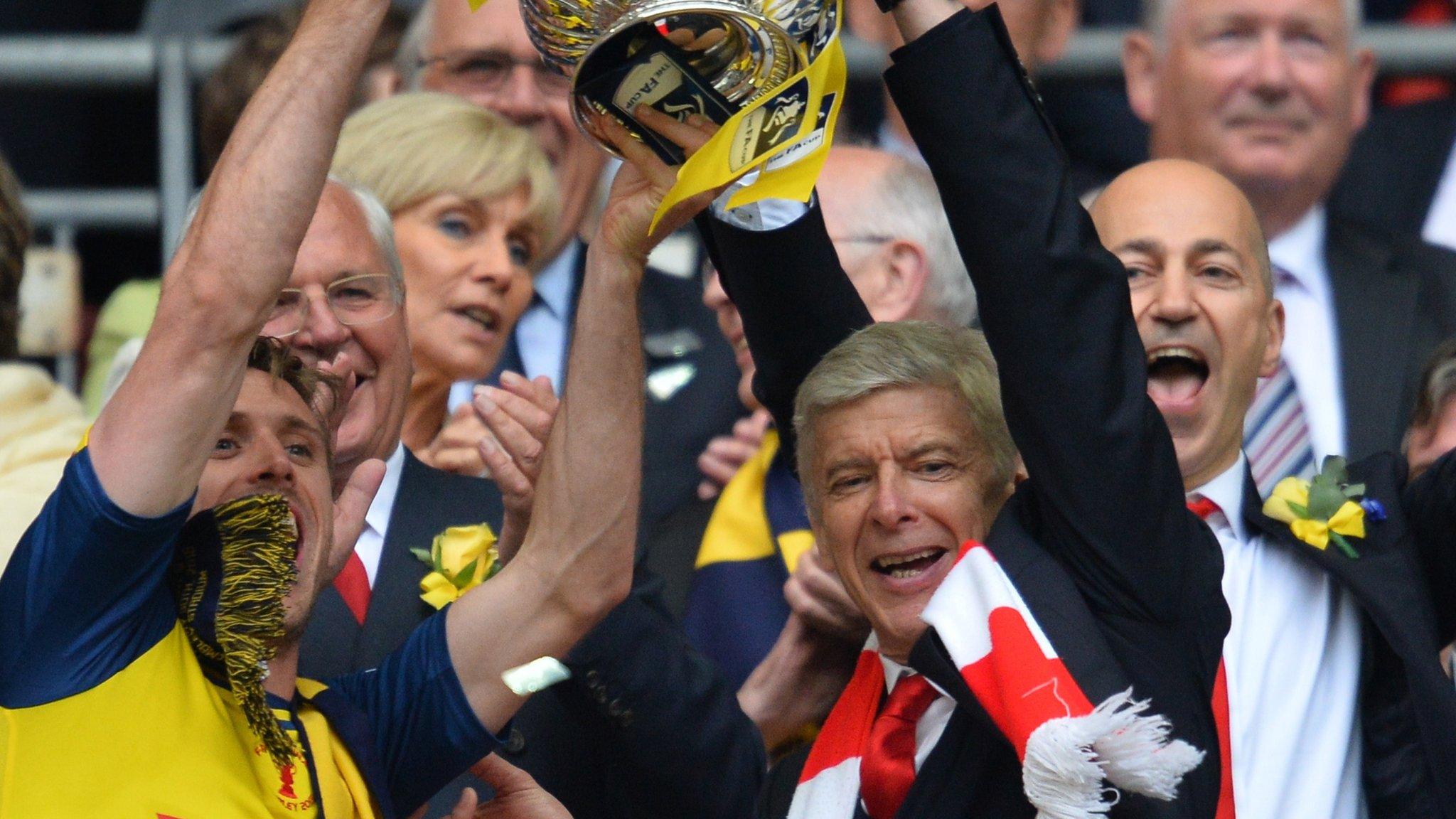 Arsene Wenger lifts the FA Cup