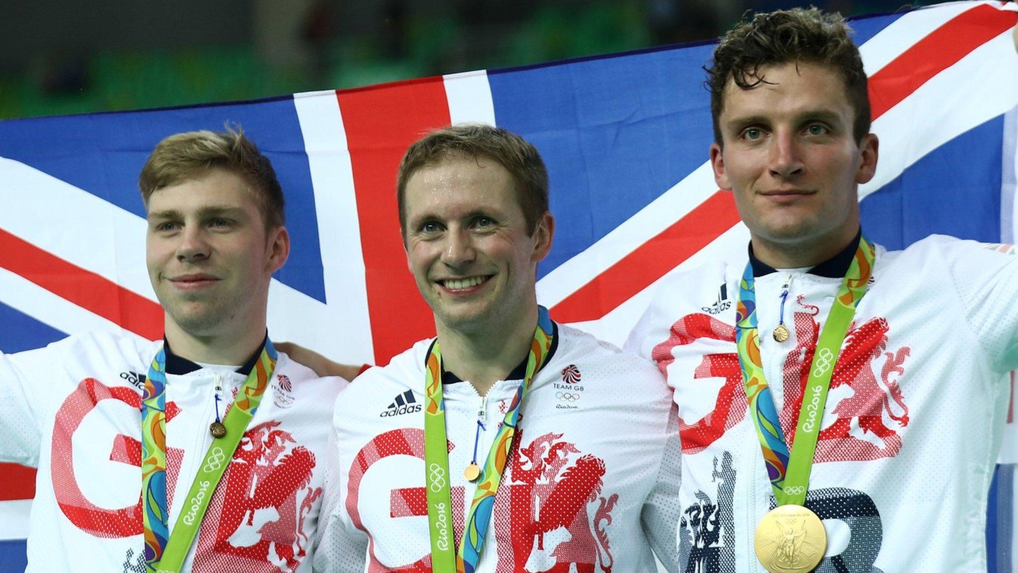 (L-R) Philip Hindes, Jason Kenny and Callum Skinner of Great Britain celebrate after winning gold and getting an Olympic record in the men's team sprint in Rio