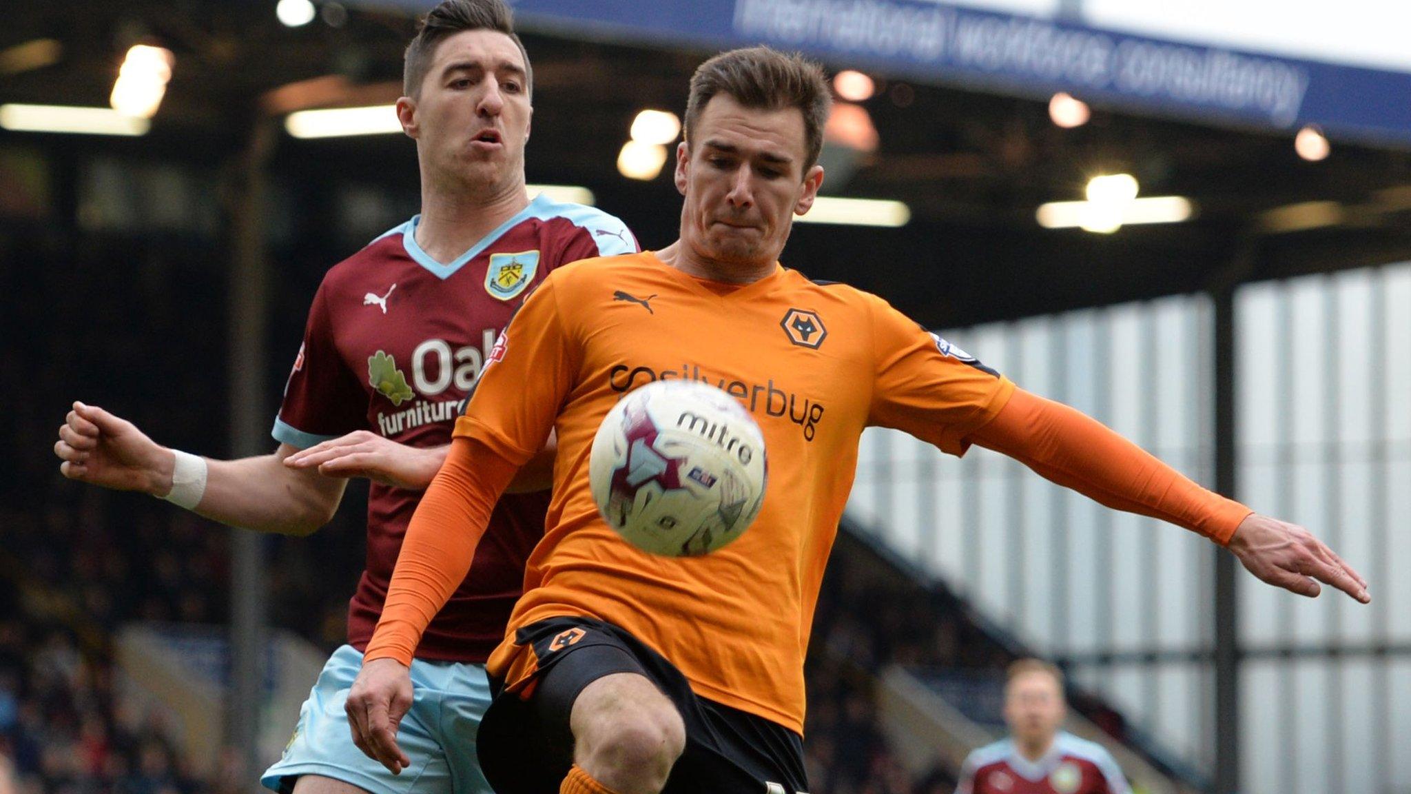 Wolves midfielder Jed Wallace is challenged by Burnley defender Stephen Ward, who began his professional career at Molineux