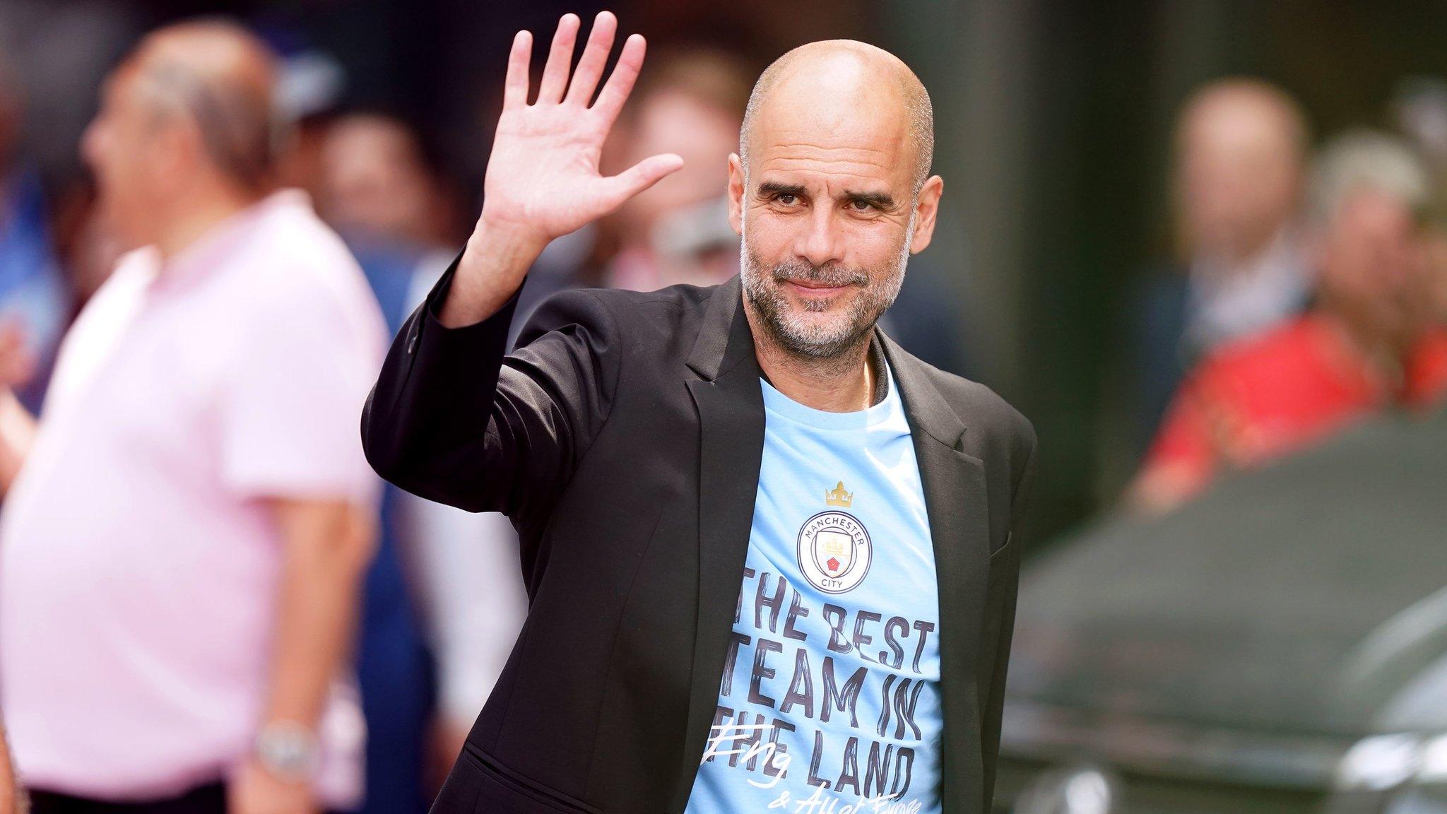 Manchester City manager Pep Guardiola waves to the cameras in Istanbul on Sunday