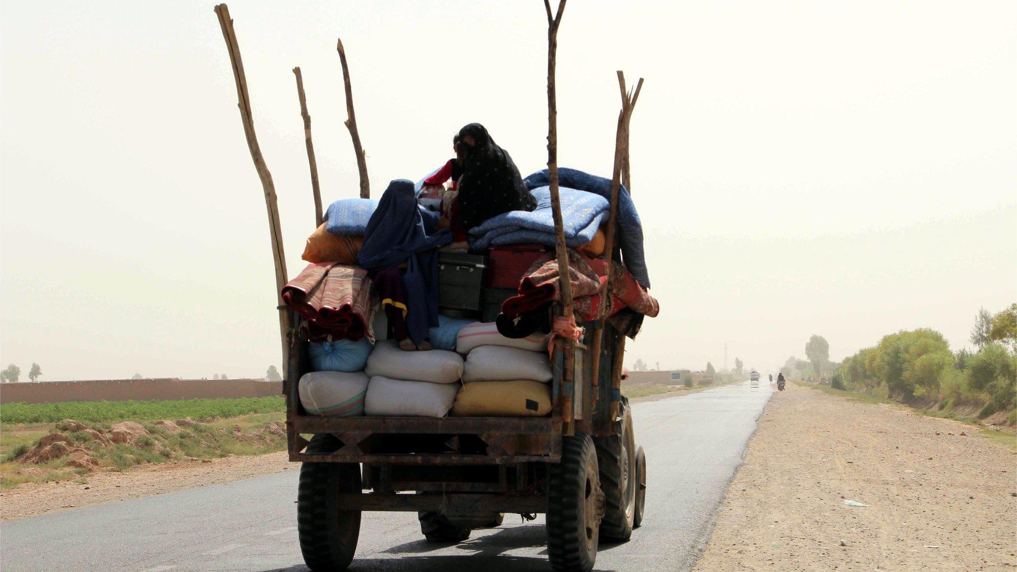 Afghan families have been fleeing the Helmand countryside as battles between Afghan troops and the Taliban have become more intense