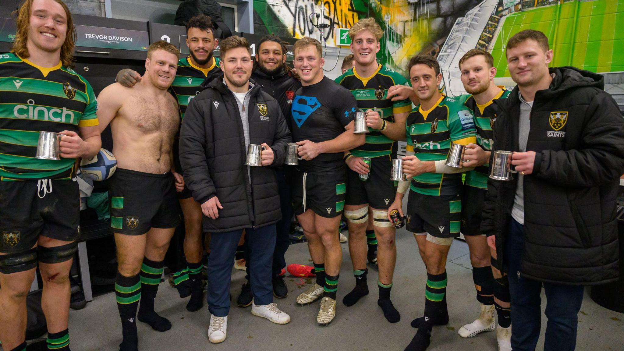 Rugby players with tankards