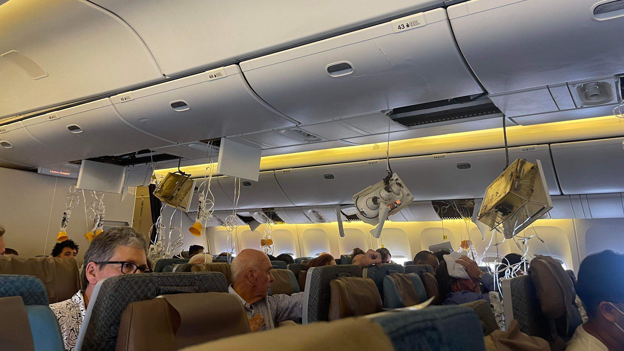 Oxygen masks dangling from the overhead panel