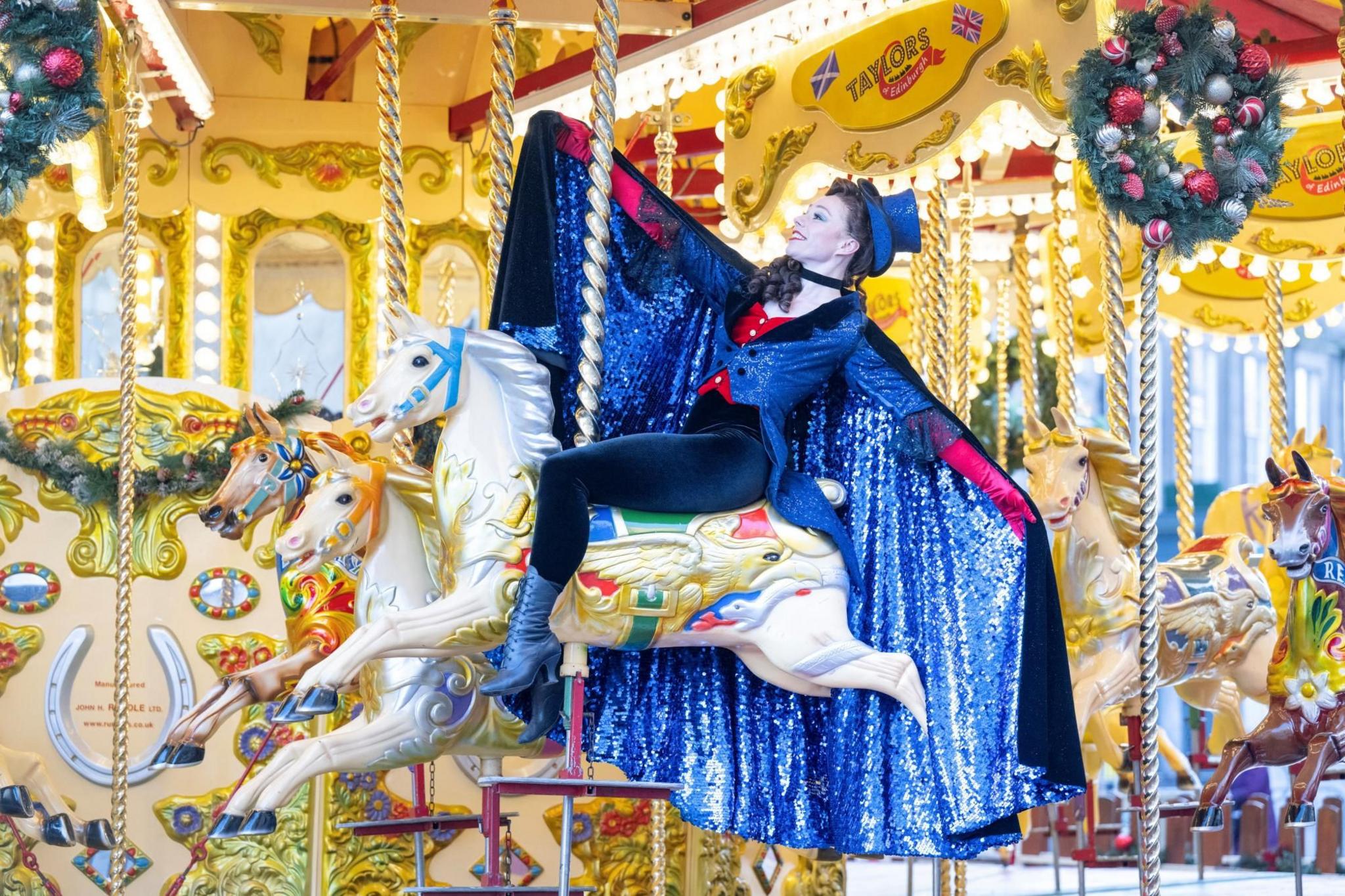 Scottish Ballet dancer Melissa Parsons poses on a carousel 
