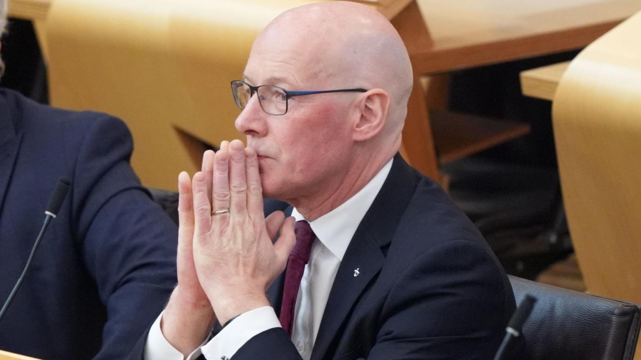 John Swinney in Scottish Parliament chamber