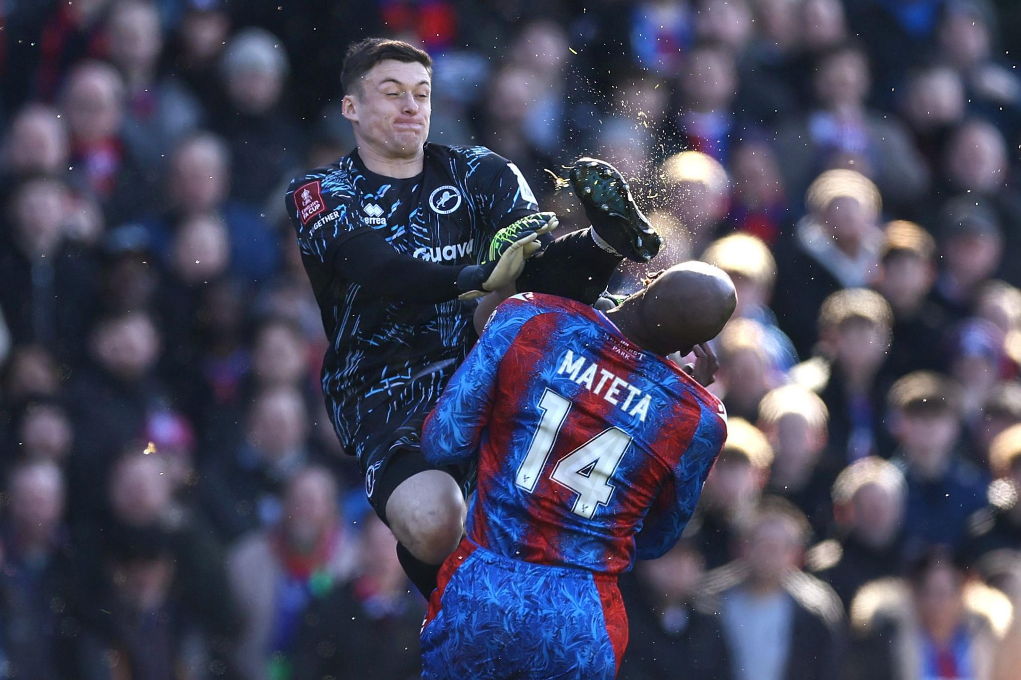 Millwall goalkeeper Liam Roberts karate kicks Jean-Philippe Mateta of Crystal Palace in the head and is subsequently sent off for a dangerous tackle during the Emirates FA Cup Fifth Round match between Crystal Palace and Millwall at Selhurst Park 