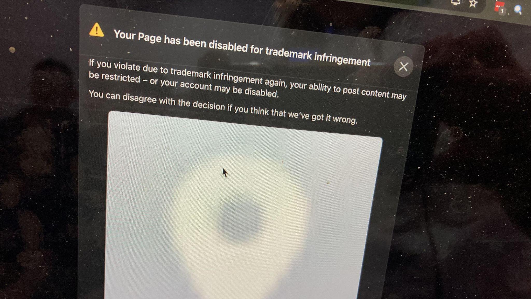 A screenshot of a web page showing a warning that reads your page has been disabled for trademark infringement. If you violate due to trademark infringement again, your ability to post content may be restricted - or your account may be disabled. You can disagree with the decision if you think that we've got it wrong.