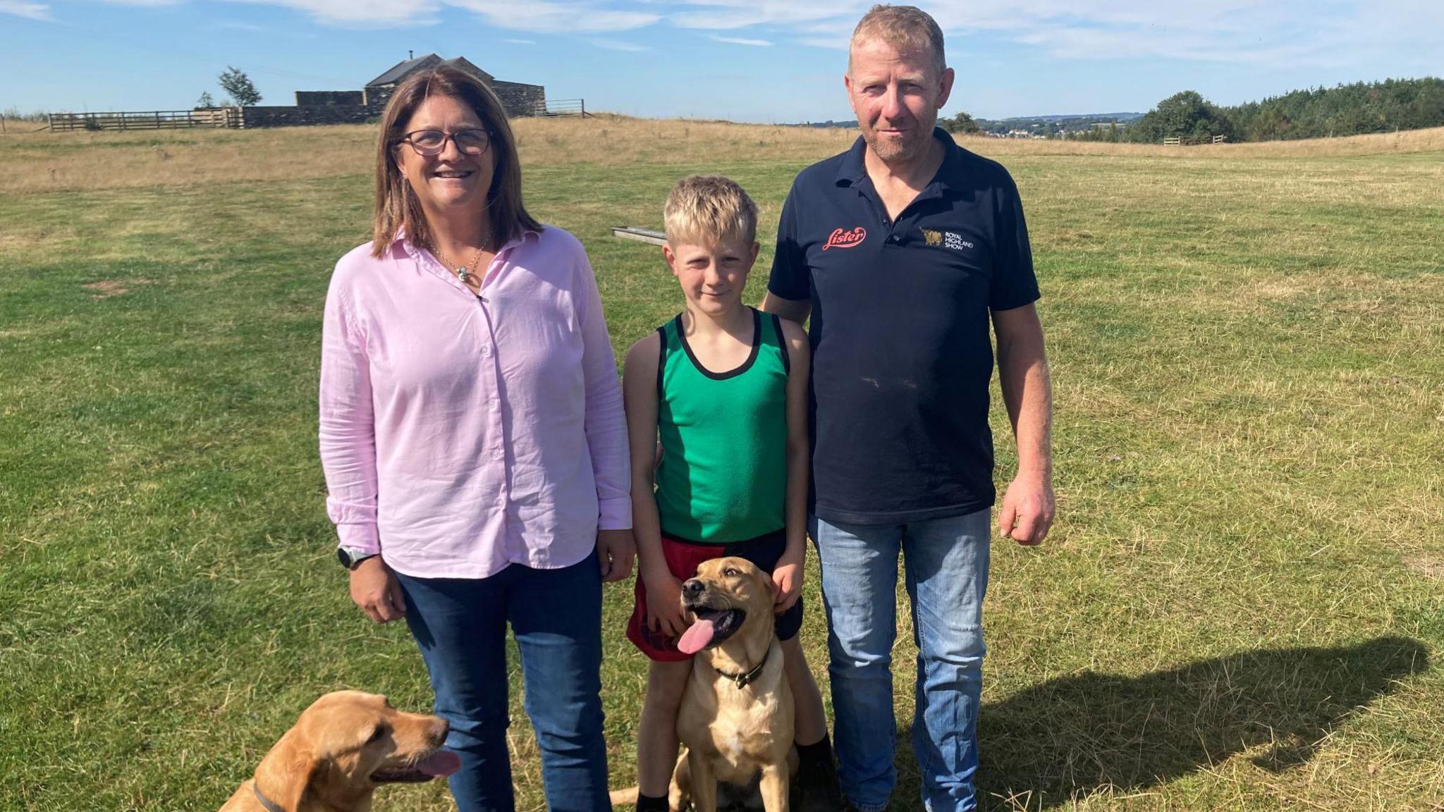 Family of Aaron Bell, Nicola, Luke and Andrew, on a farm in Masham with two dogs 