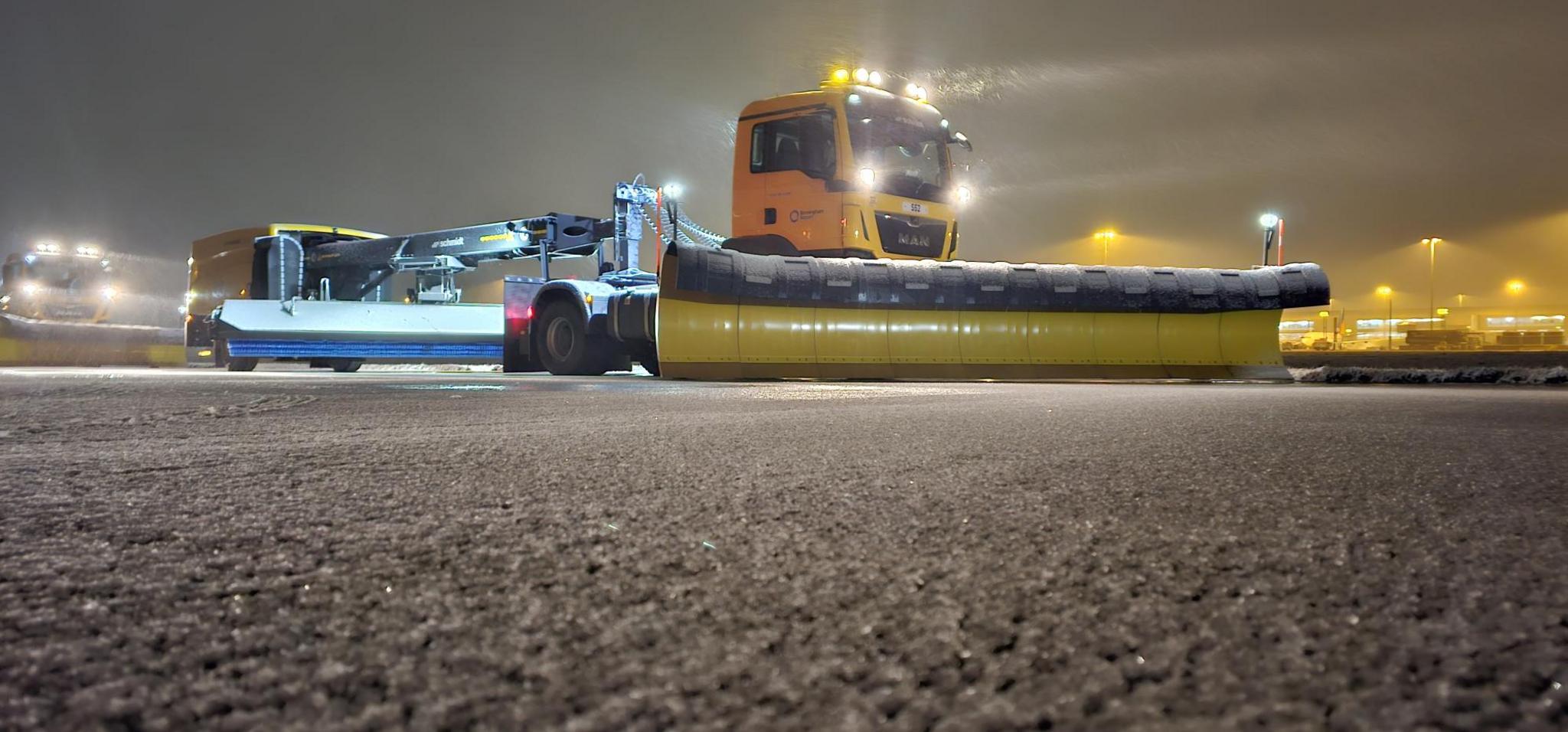 A snow plough on an airport runway