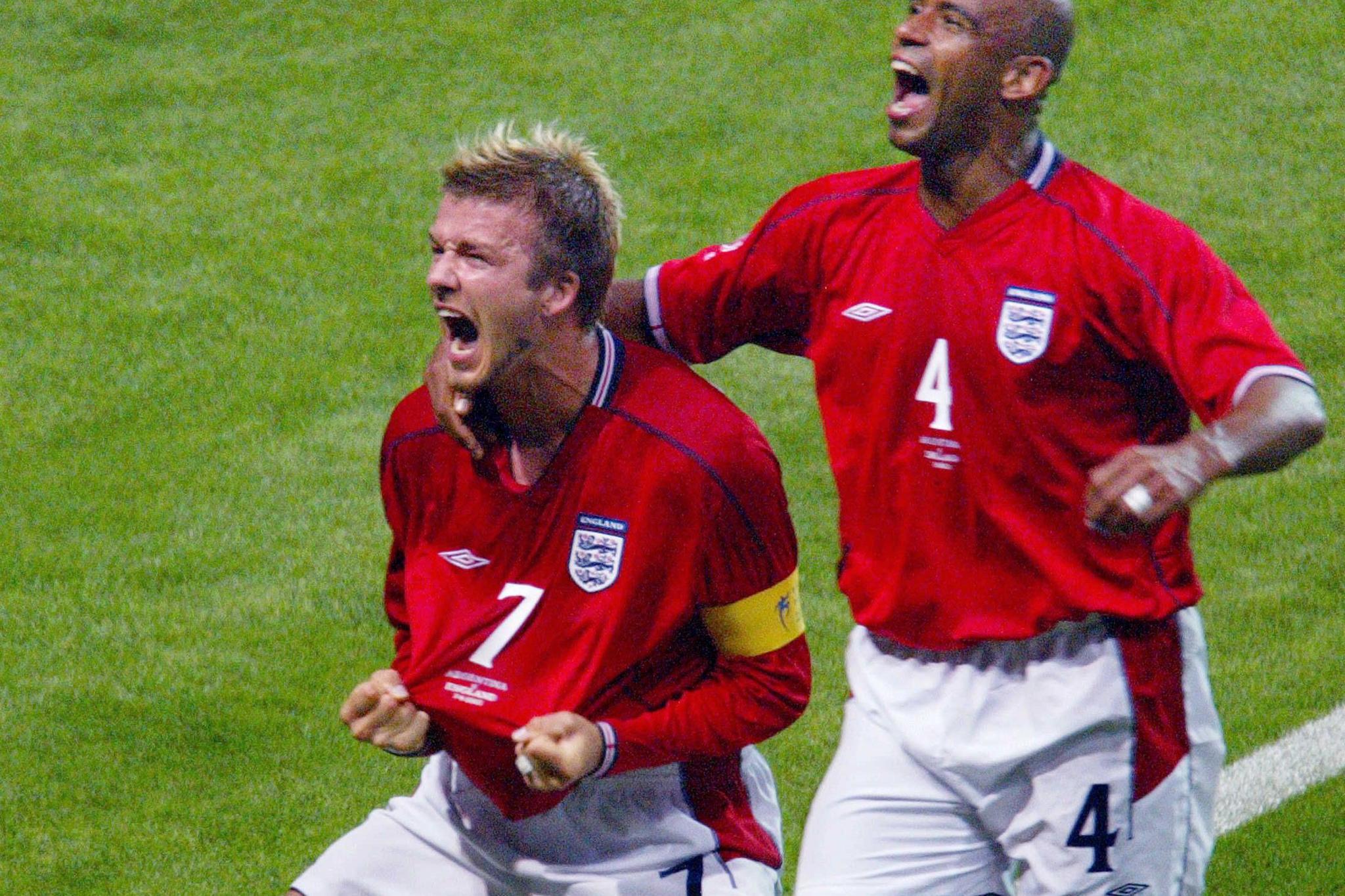 David Beckham celebrates (with Trevor Sinclair) after scoring against Argentina at the 2002 World Cup