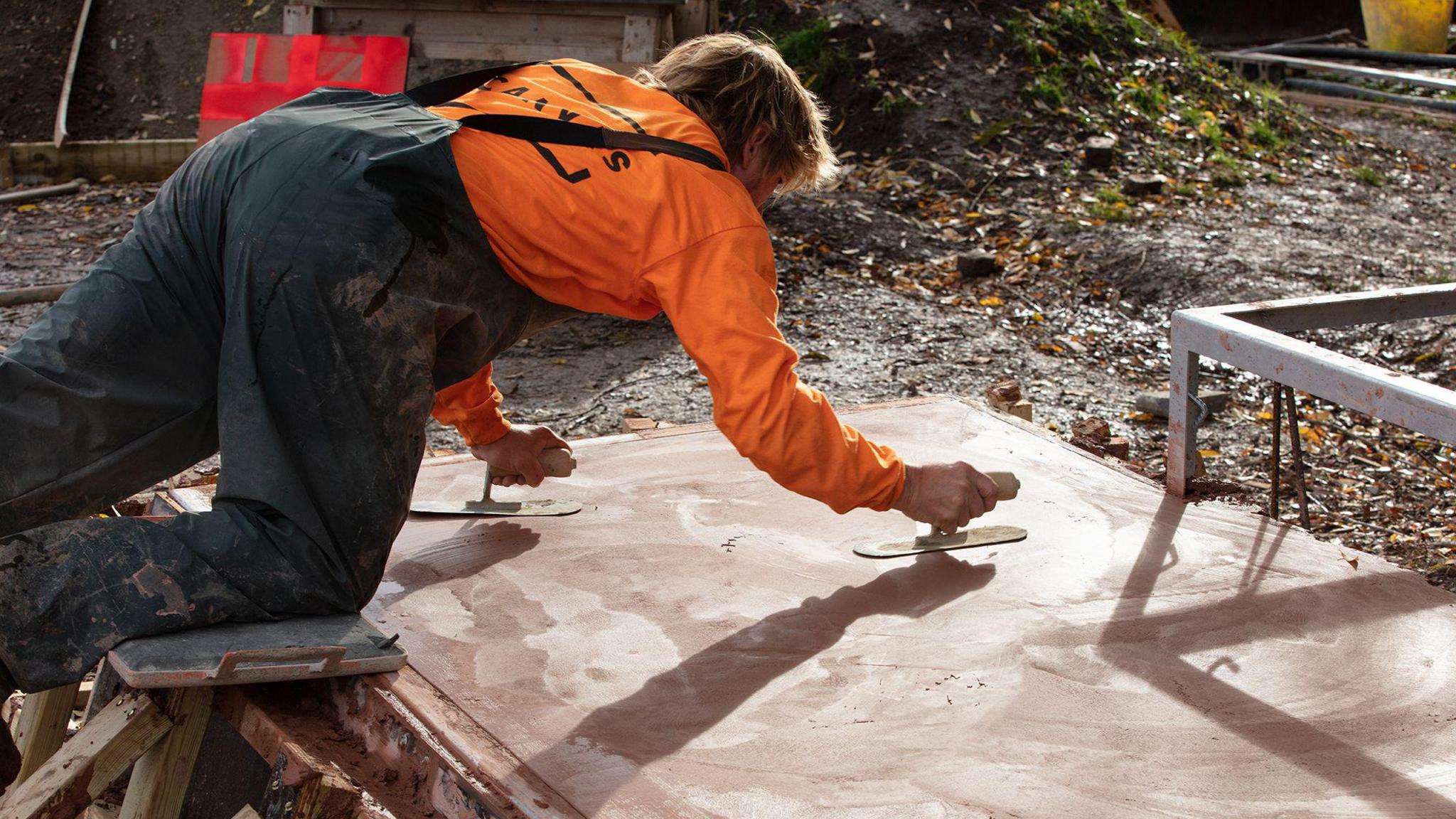 A worker at the building site of the new skatepark
