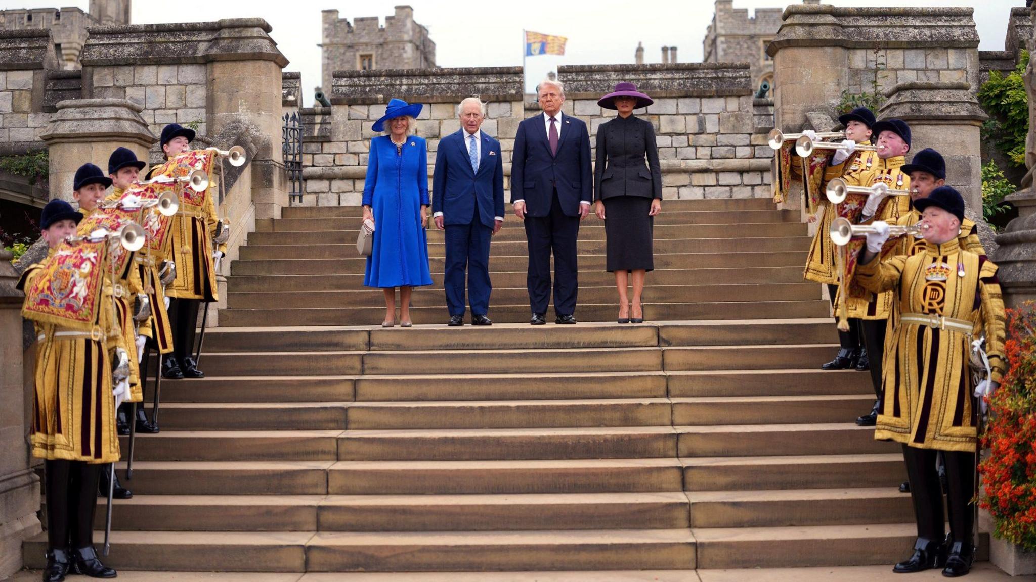 Trumpeters fanfare as U.S. President Donald Trump and First Lady Melania Trump participate in a Windsor Castle East Lawn Ceremony with King Charles and Queen Camilla 