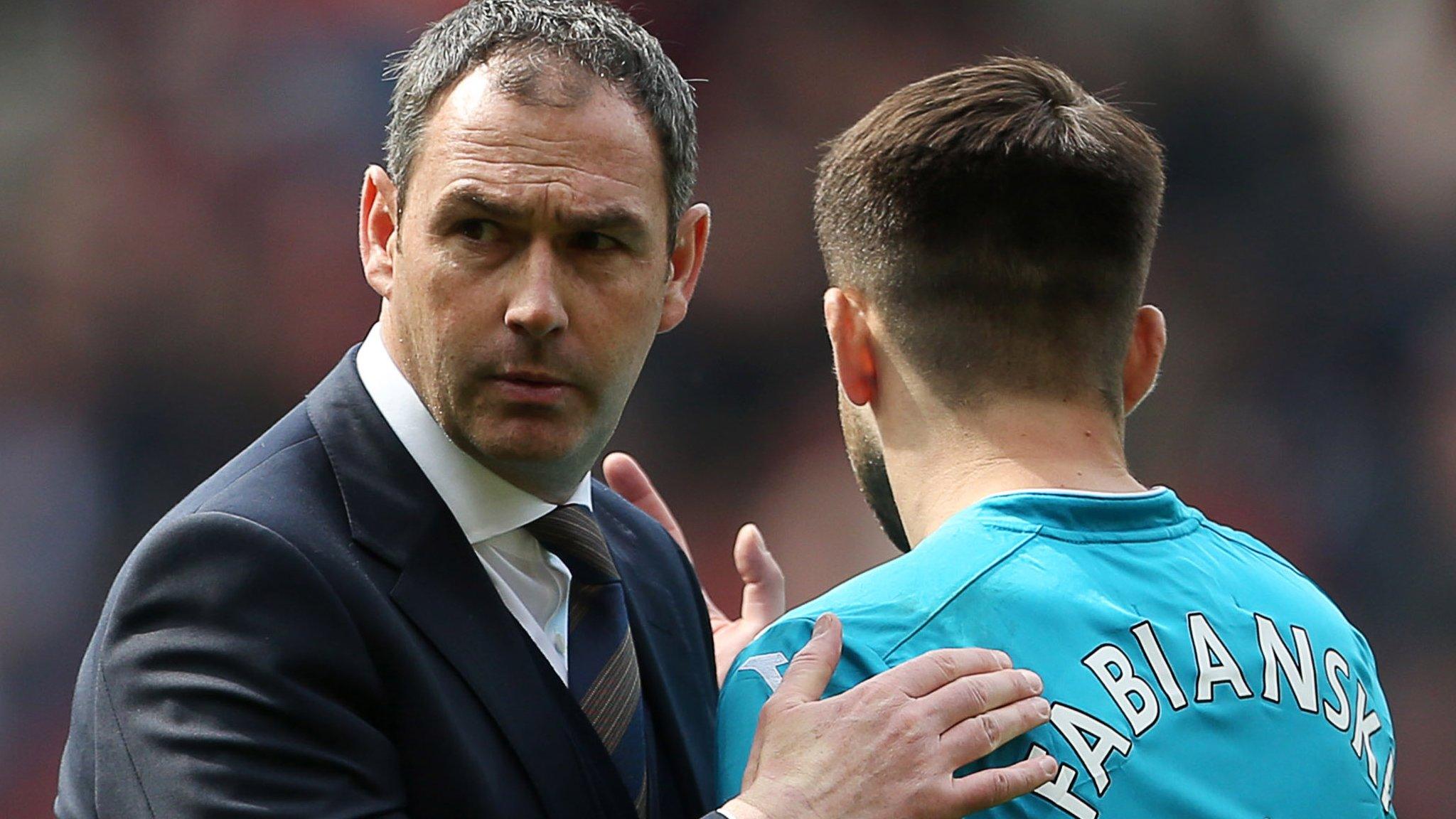 Paul Clement pats Lucasz Fabianski on the back