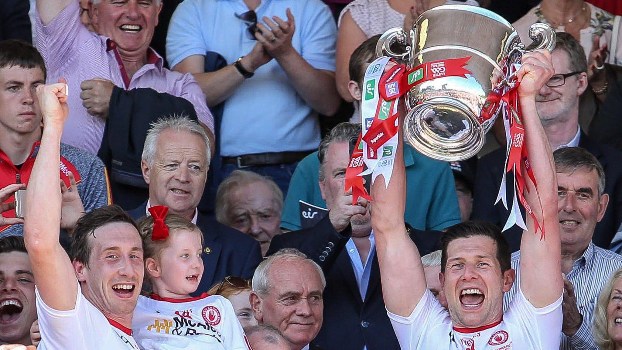 Colm Cavanagh celebrates as his brother Sean lifts the Anglo Celt Cup