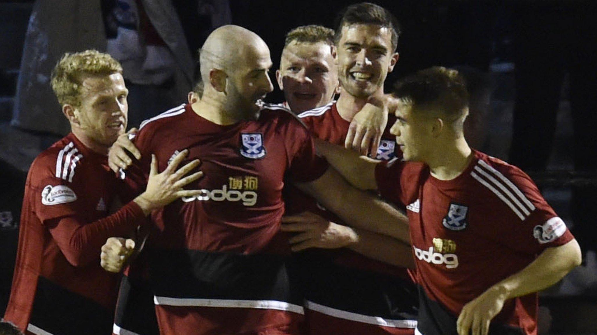 Ayr celebrate their late winner as Falkirk players look distraught