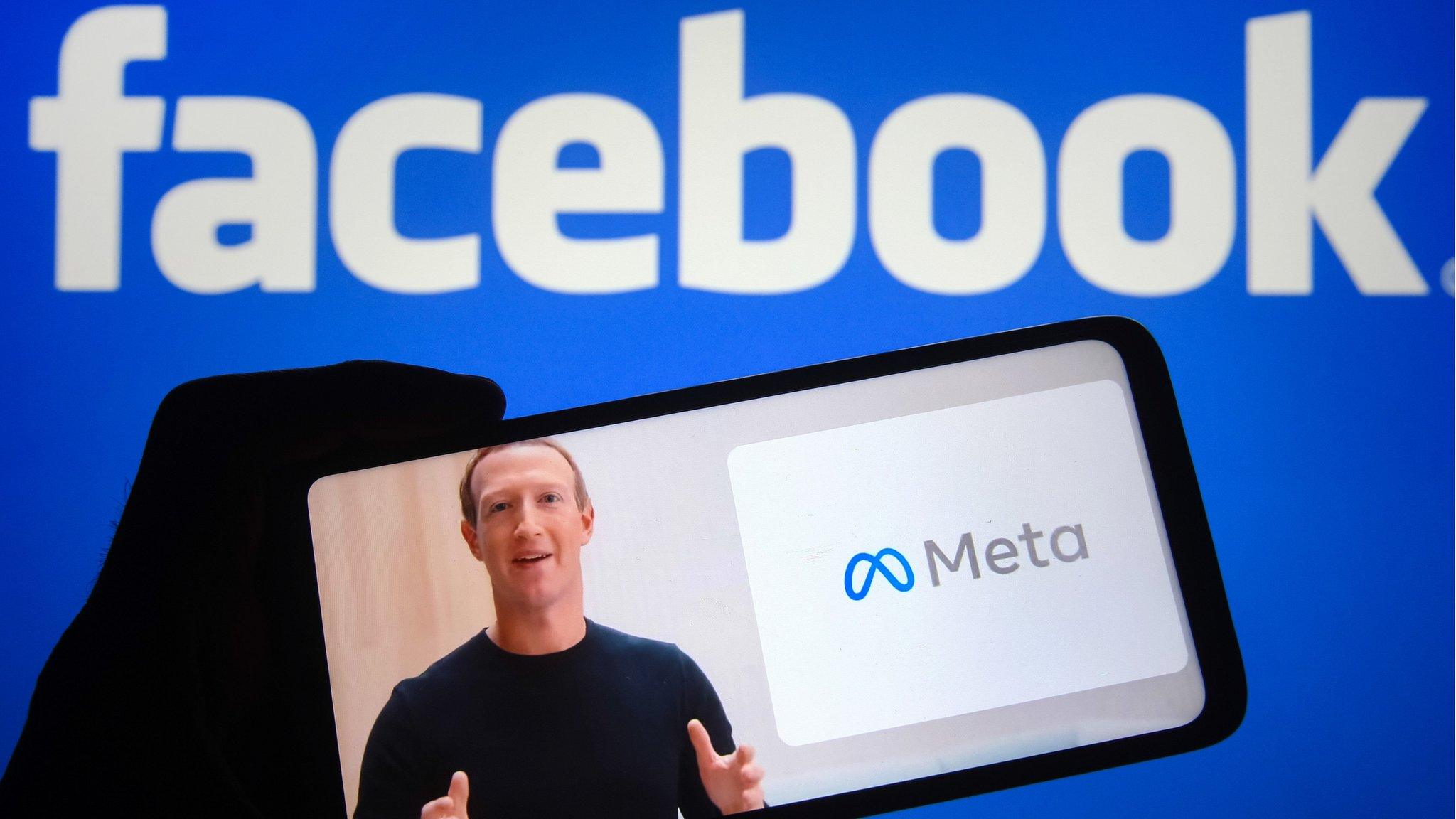 Mark Zuckerberg announcing the launch of meta on a phone