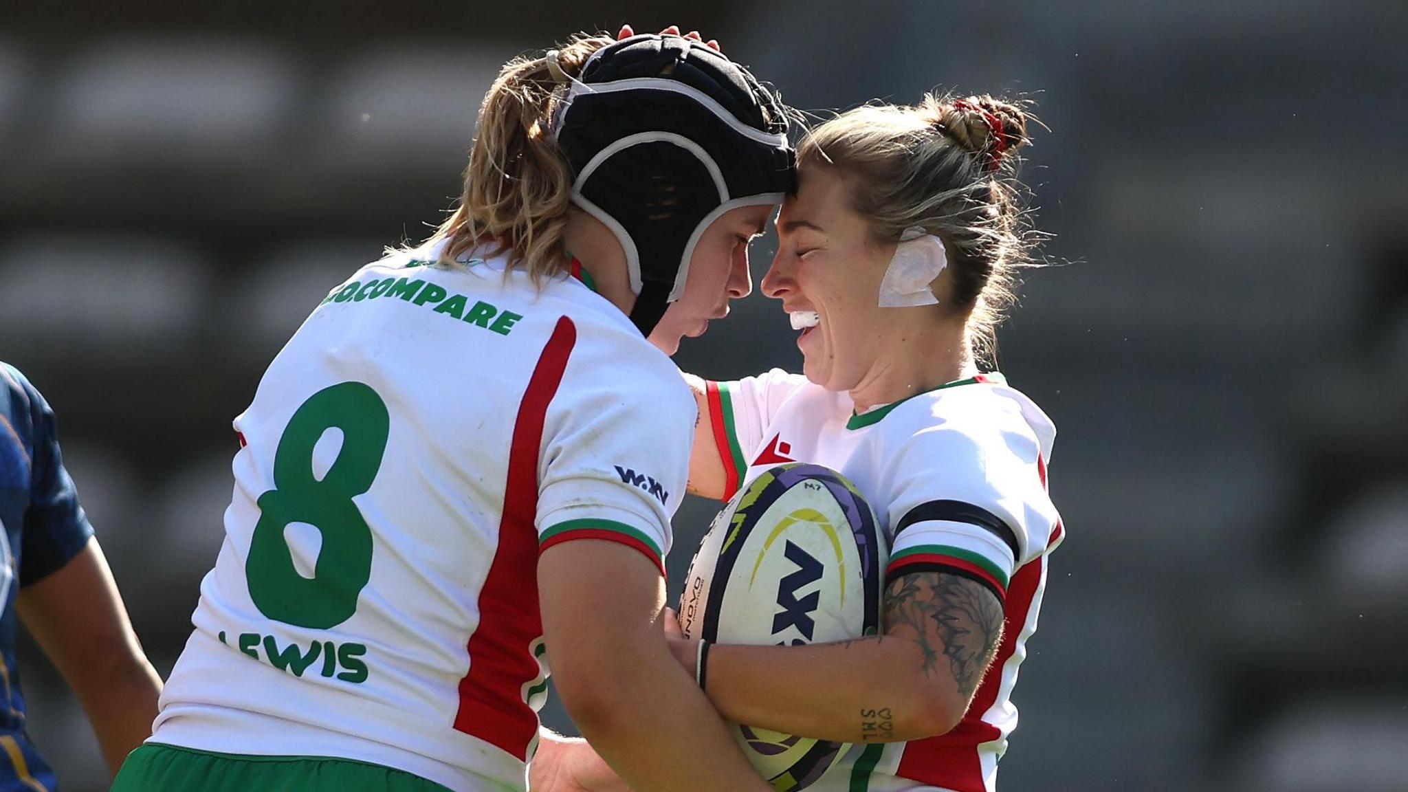 Bethan Lewis and Keira Bevan celebrate one of Wales' tries