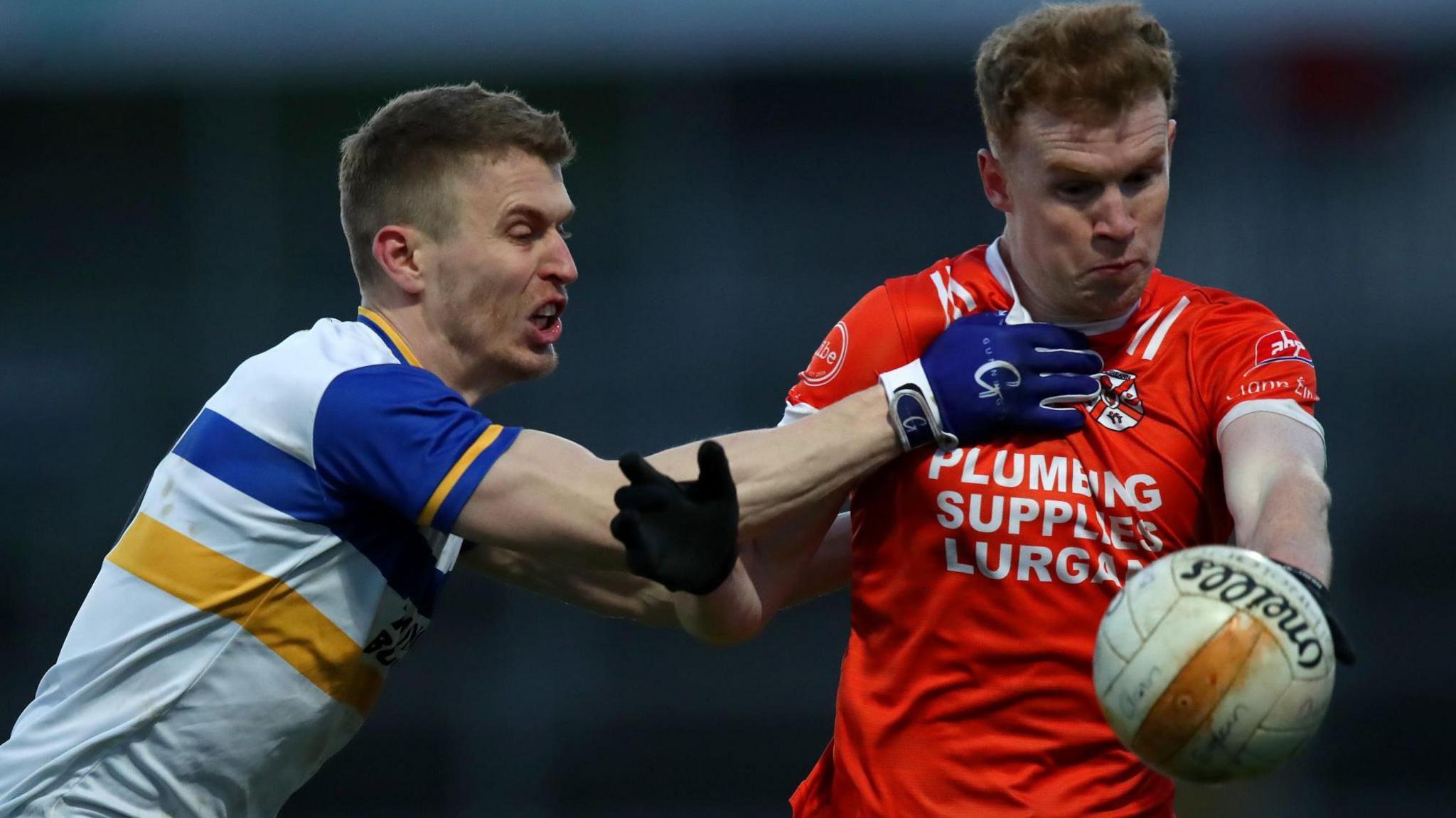 Errigal Ciaran defender Ben McDonnell challenges Clann Eireann's Armagh All-Ireland winner and All-Star Conor Turbitt