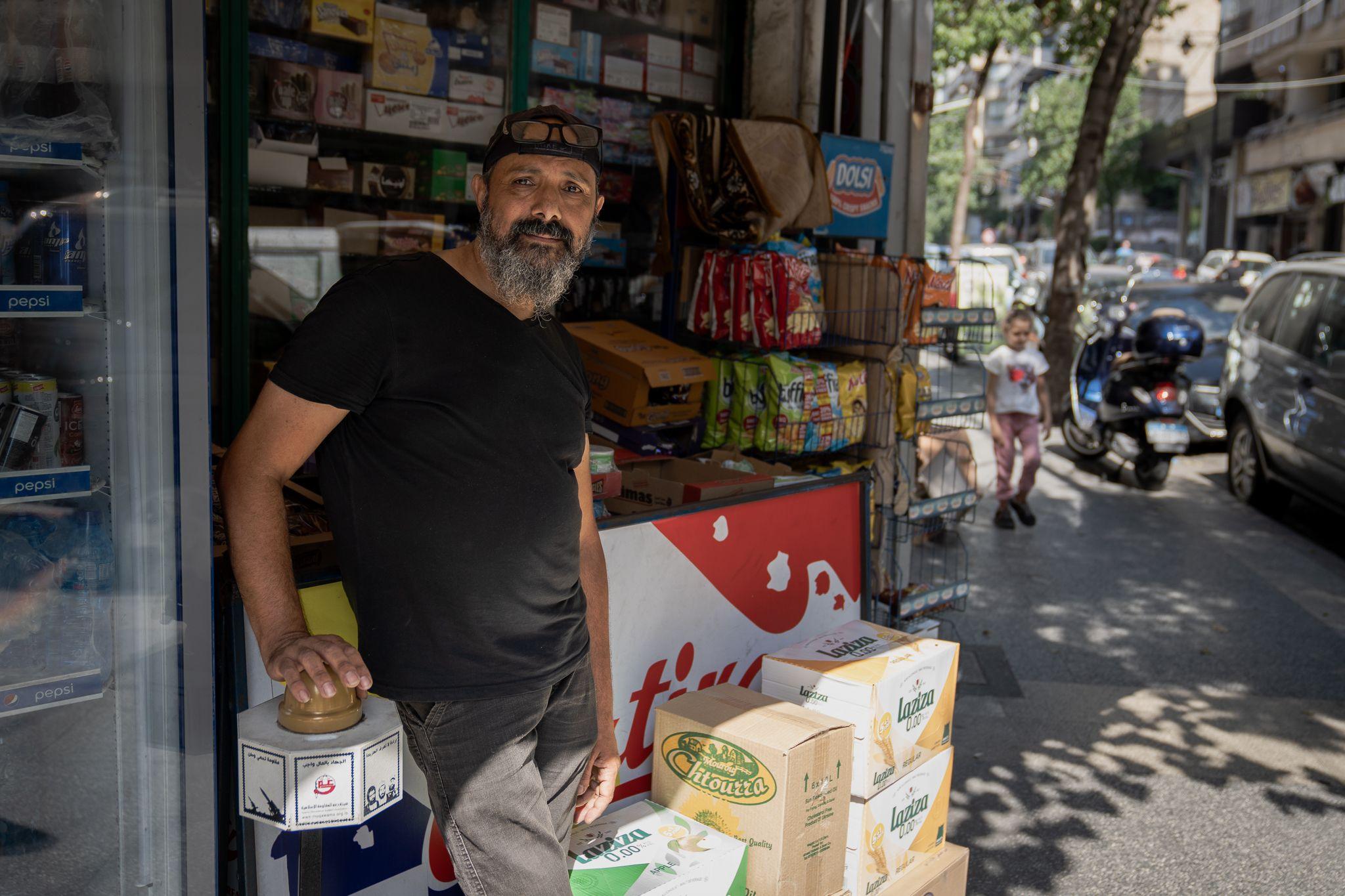 Fadi Ali Kiryani outside his Beirut shop. "We will always fly the flag for Hezbollah," he said.