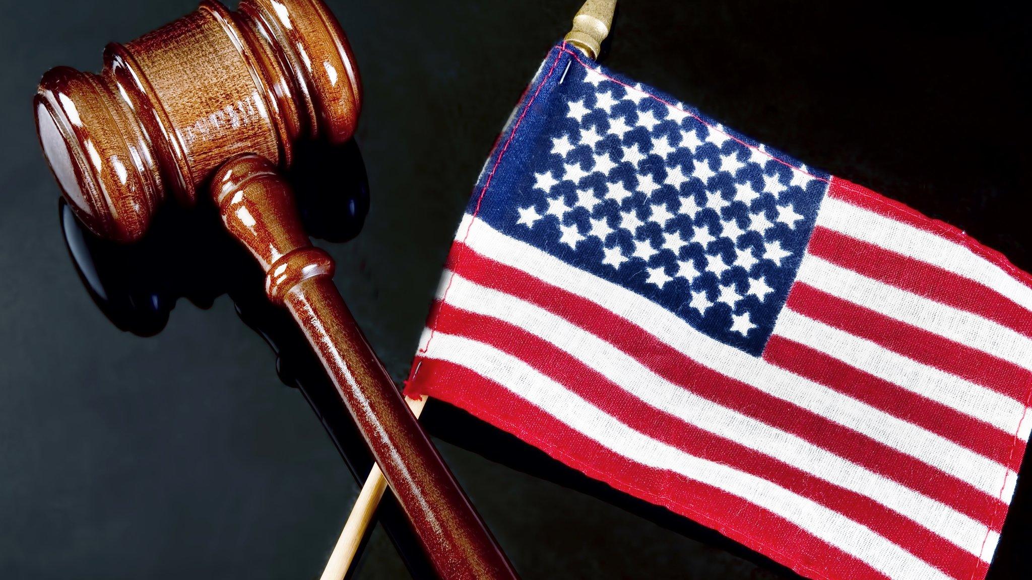 A gavel and US flag