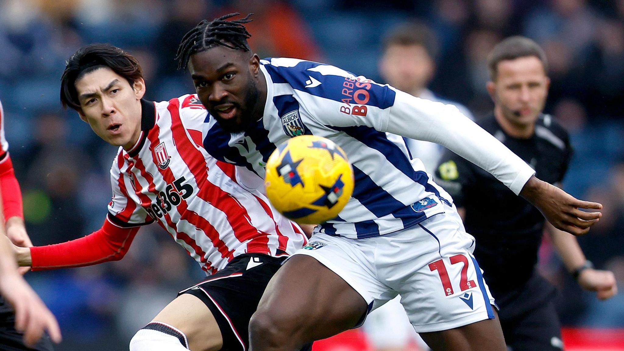 West Brom striker Daryl Dike and Stoke City midfielder Tatsuki Seko battle for the ball at The Hawthorns