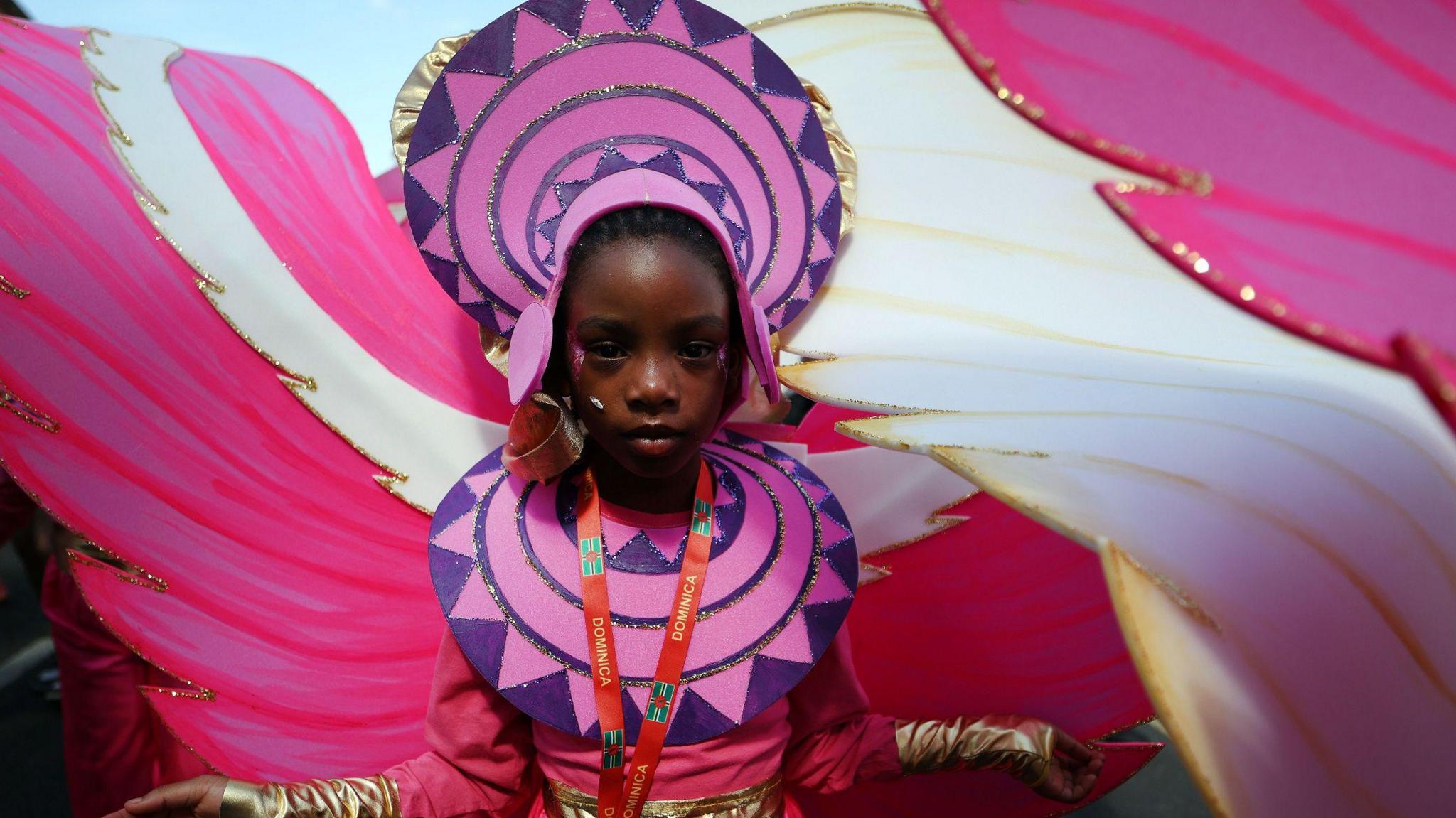 A girl wearing a colourful costume.