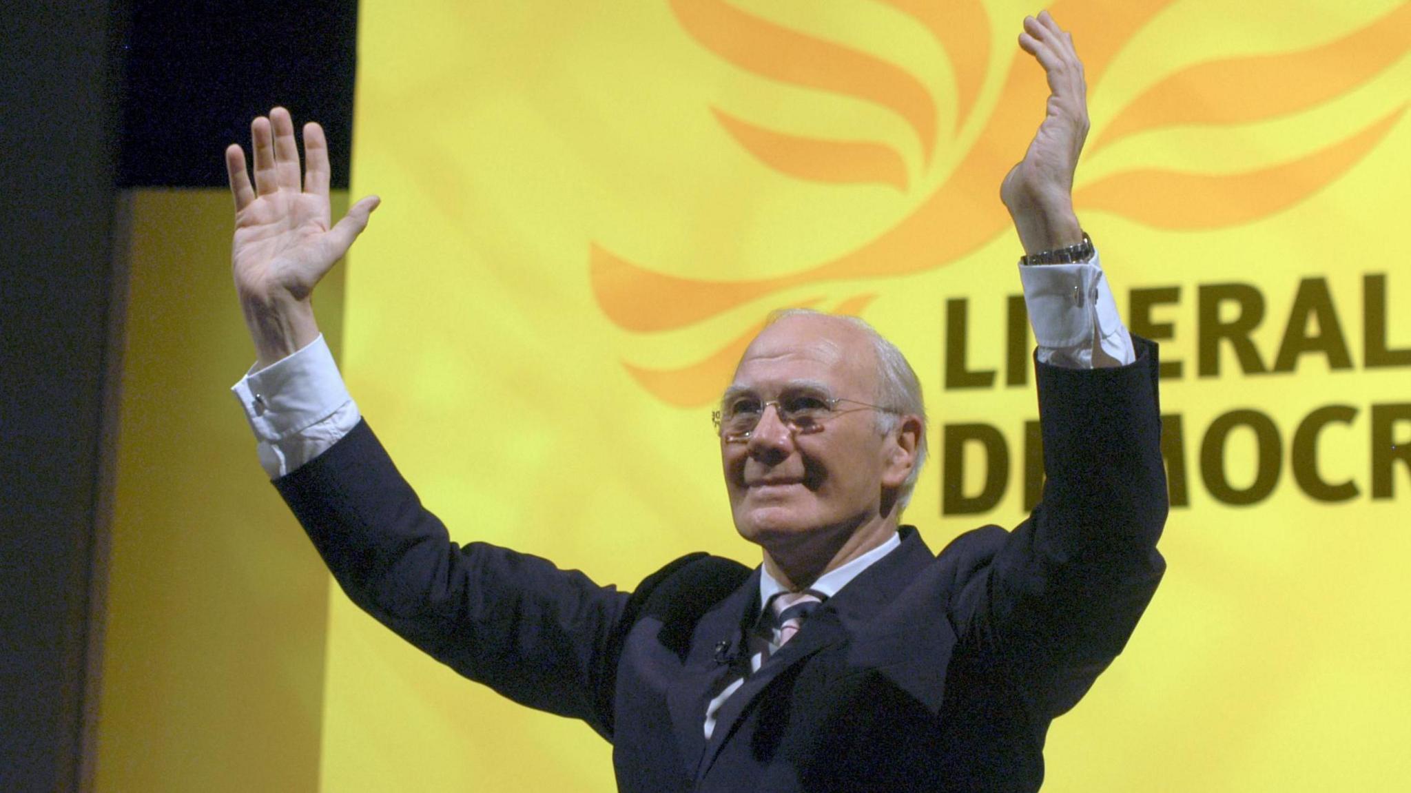 Campbell after his keynote speech as party leader in 2006. He is holding his arms aloft to salute the crowd's applause.