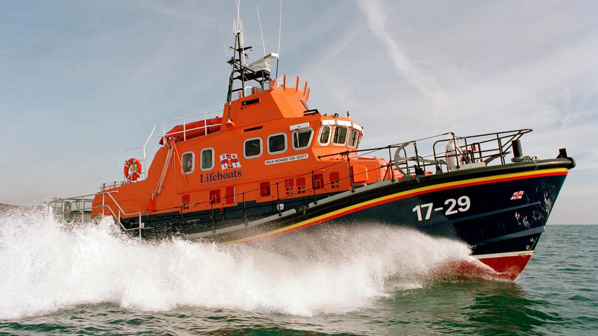 Richard Cox Scott on exercise in Falmouth Bay in February 2002. There is sea spray beside her but the sea is otherwise calm in the picture.