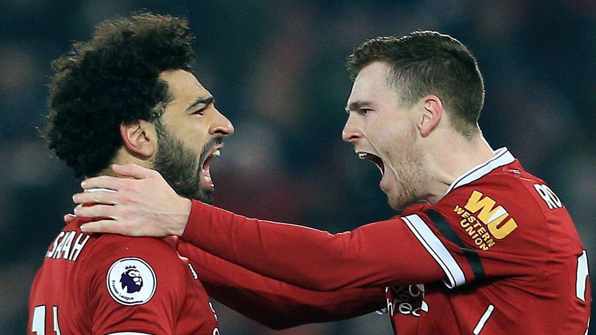 Liverpool forward Mohamed Salah celebrates his goal with Andrew Robertson