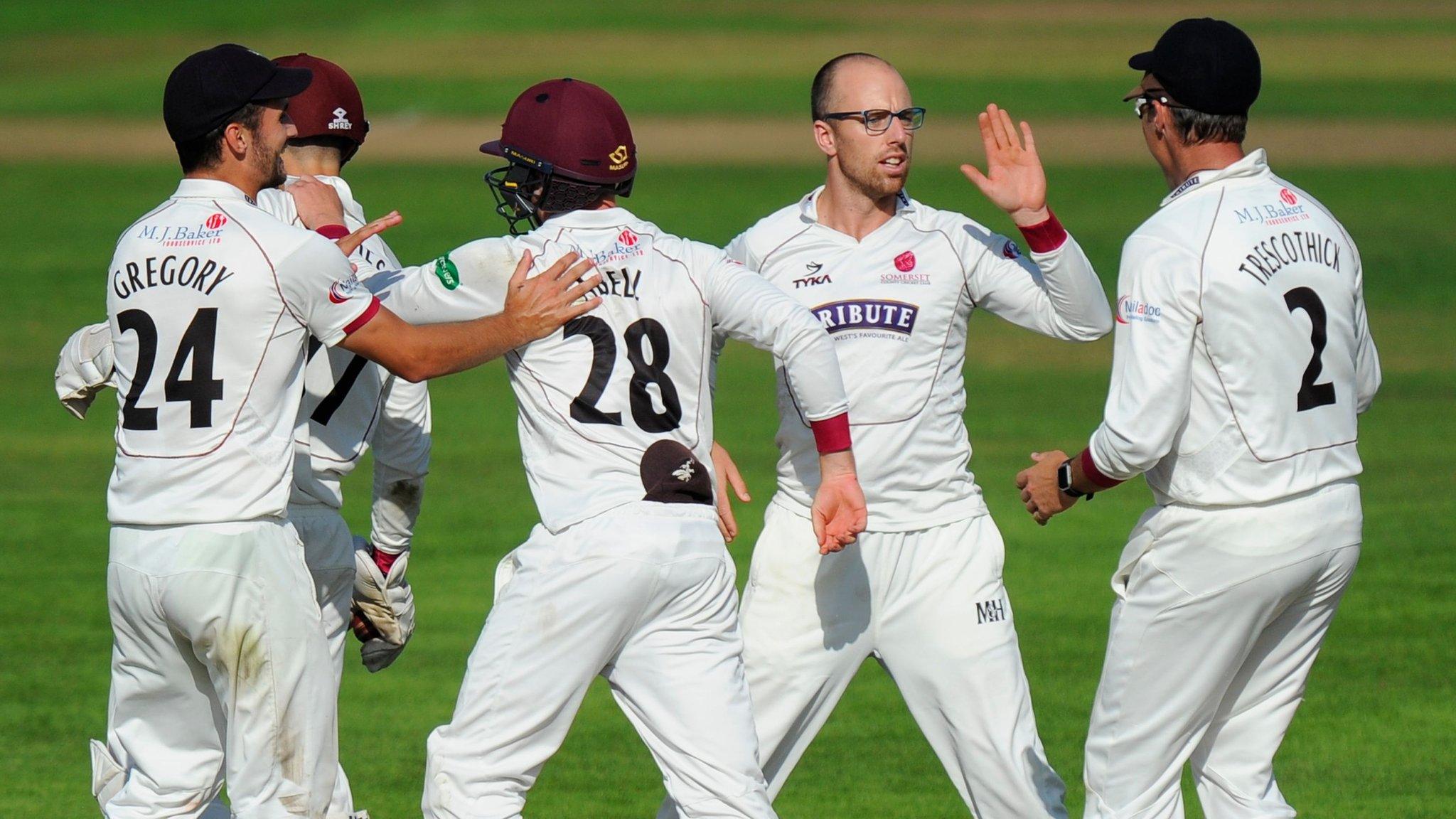 Somerset spinner Jack Leach celebrates the wicket of Jonathan Trott